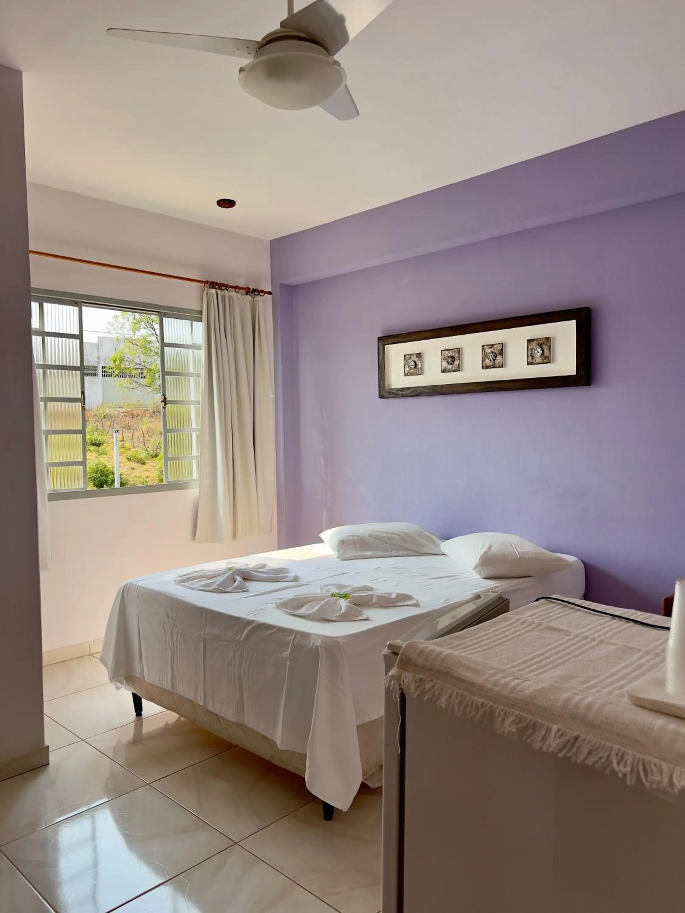 Bed in Pousada dos Contos de Carrancas