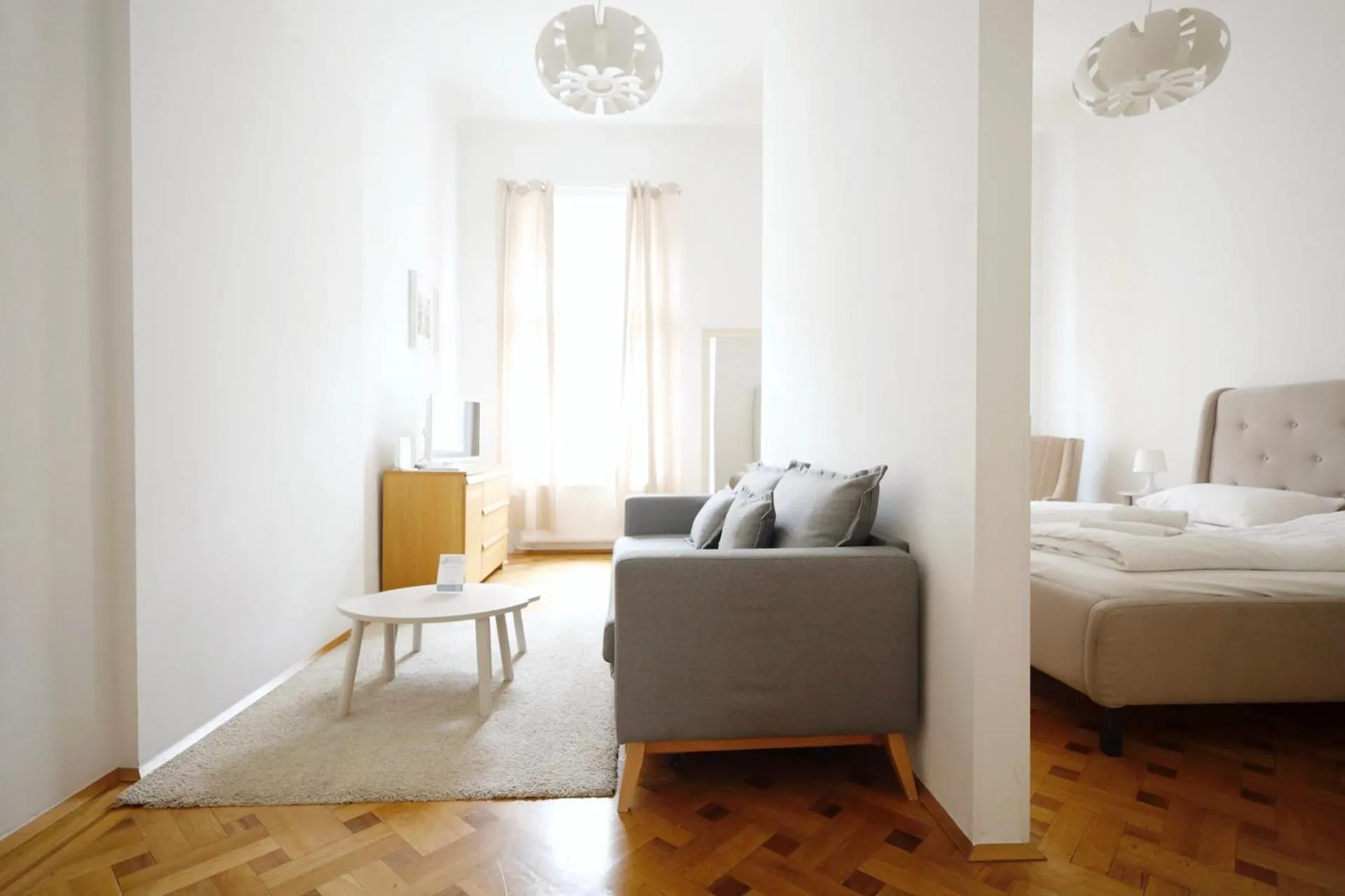 Living room, Bed in HeyMi Apartments in City Center