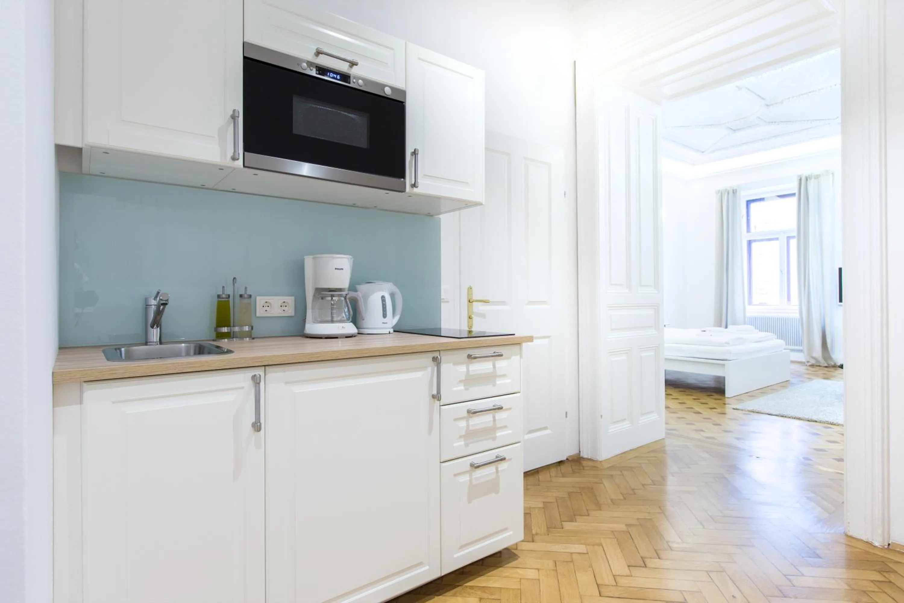 Kitchen or kitchenette, Bed in HeyMi Apartments in City Center