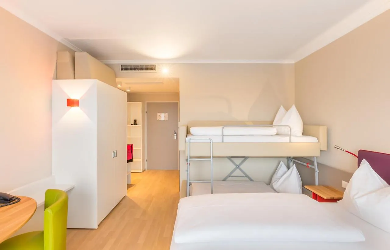 Bed in All in Red Thermenhotel