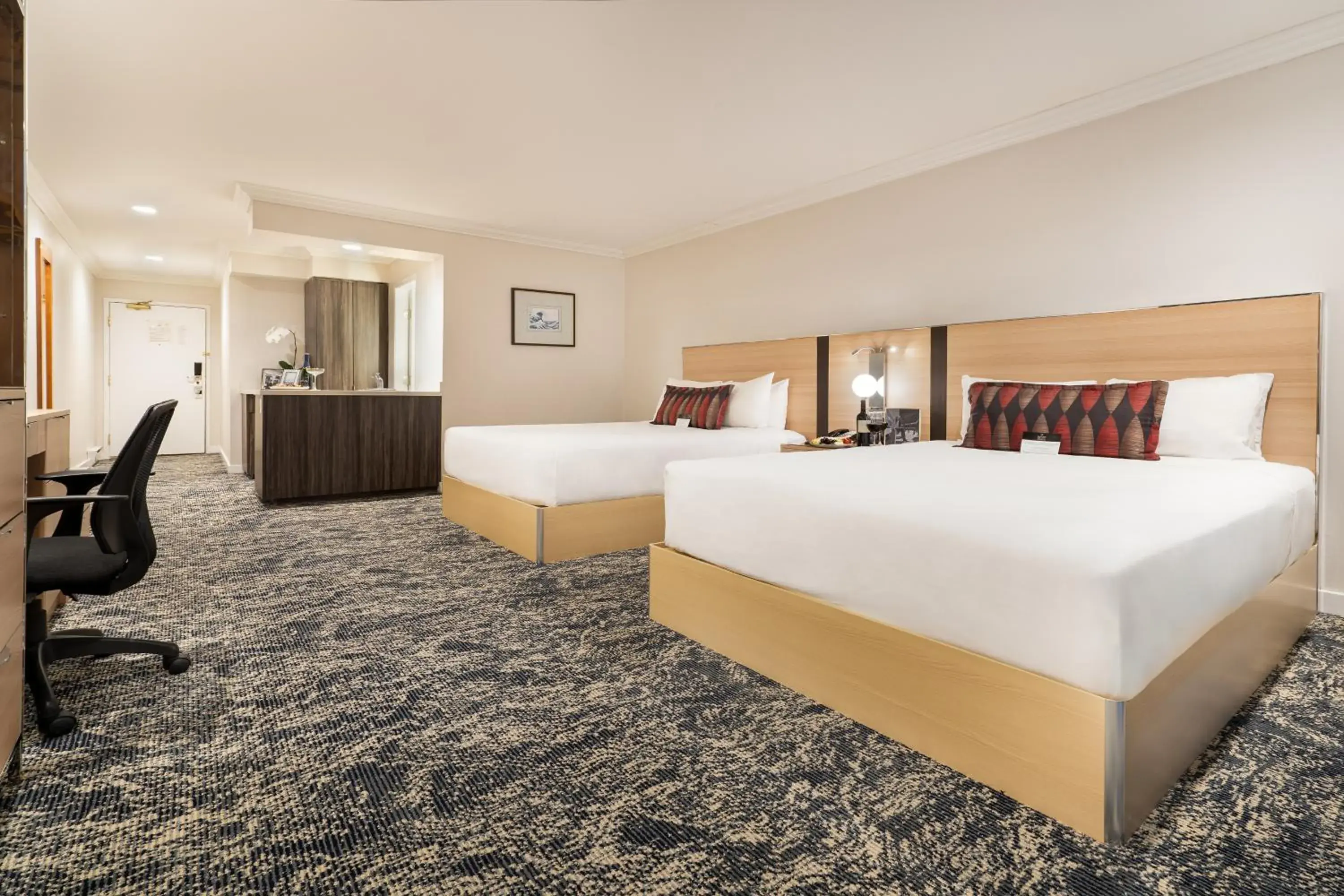 Bed in Executive Suites Hotel & Conference Center, Metro Vancouver Bed in Executive Suites Hotel & Conference Center, Metro Vancouver