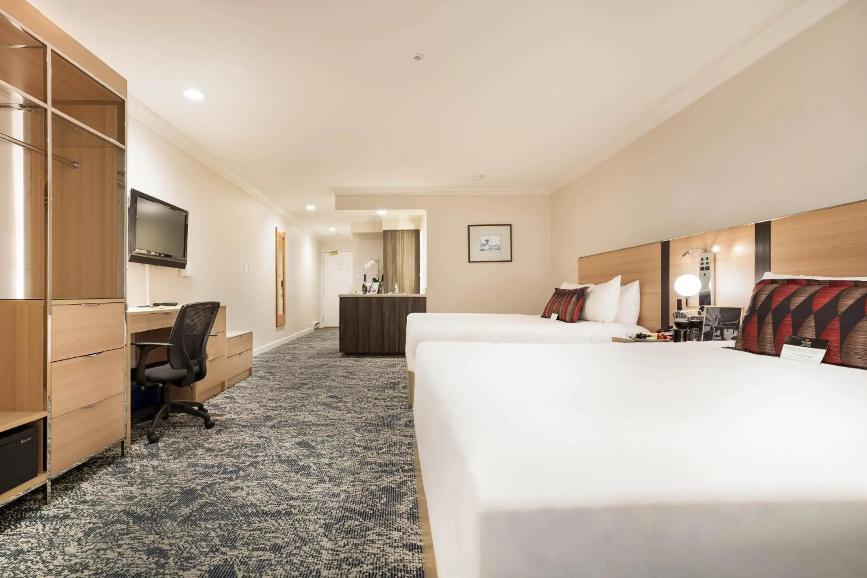 Bed in Executive Suites Hotel & Conference Center, Metro Vancouver Bed in Executive Suites Hotel & Conference Center, Metro Vancouver