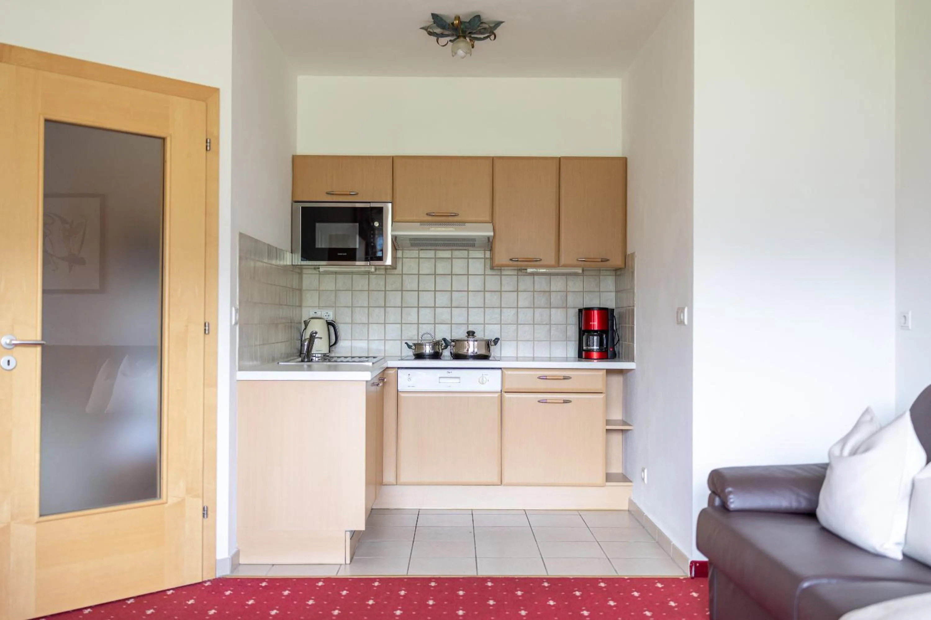Kitchen or kitchenette in EGGER Apartments & Suites