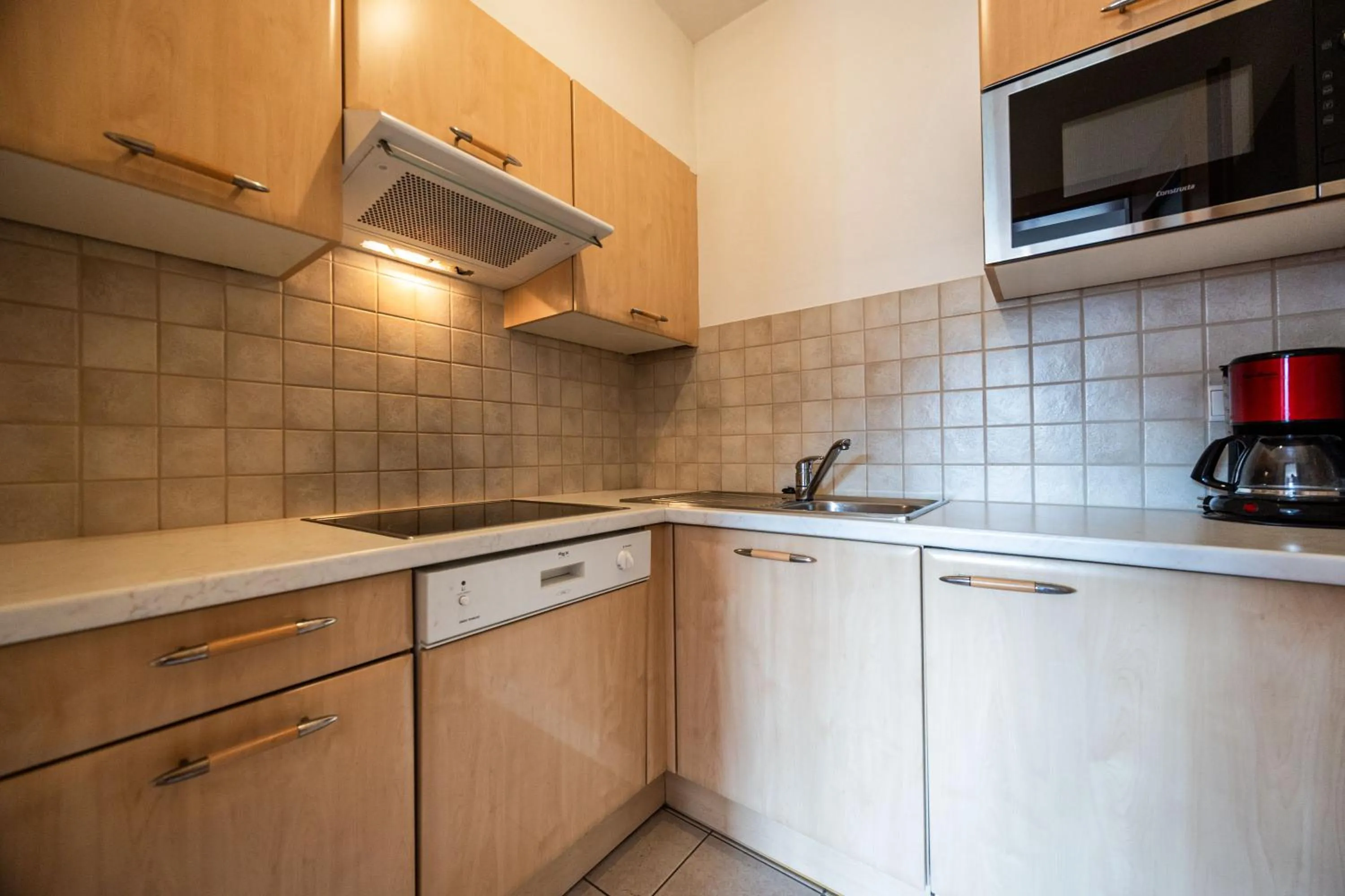 Kitchen or kitchenette in EGGER Apartments & Suites