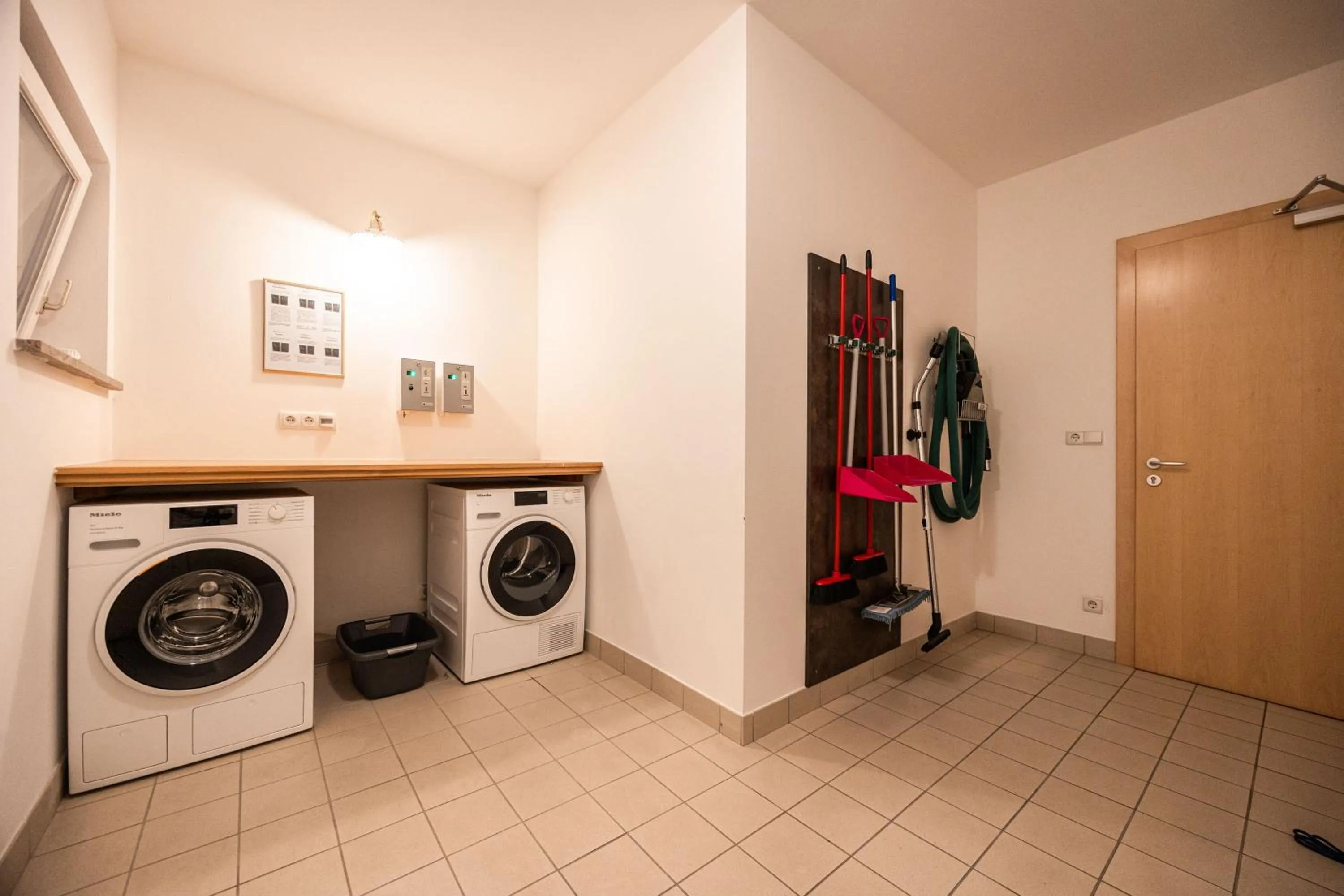 washing machine in EGGER Apartments & Suites