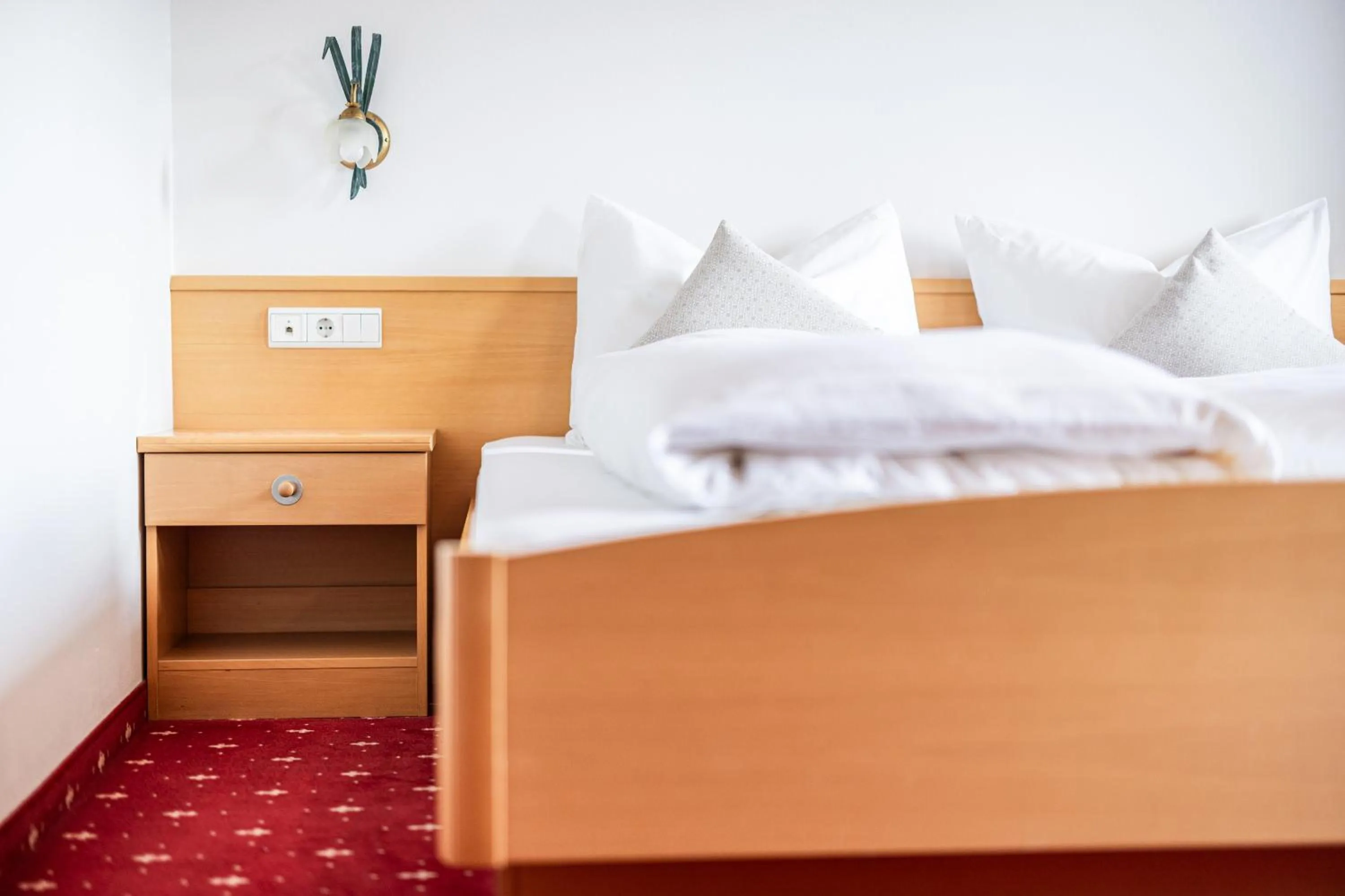 Bed in EGGER Apartments & Suites