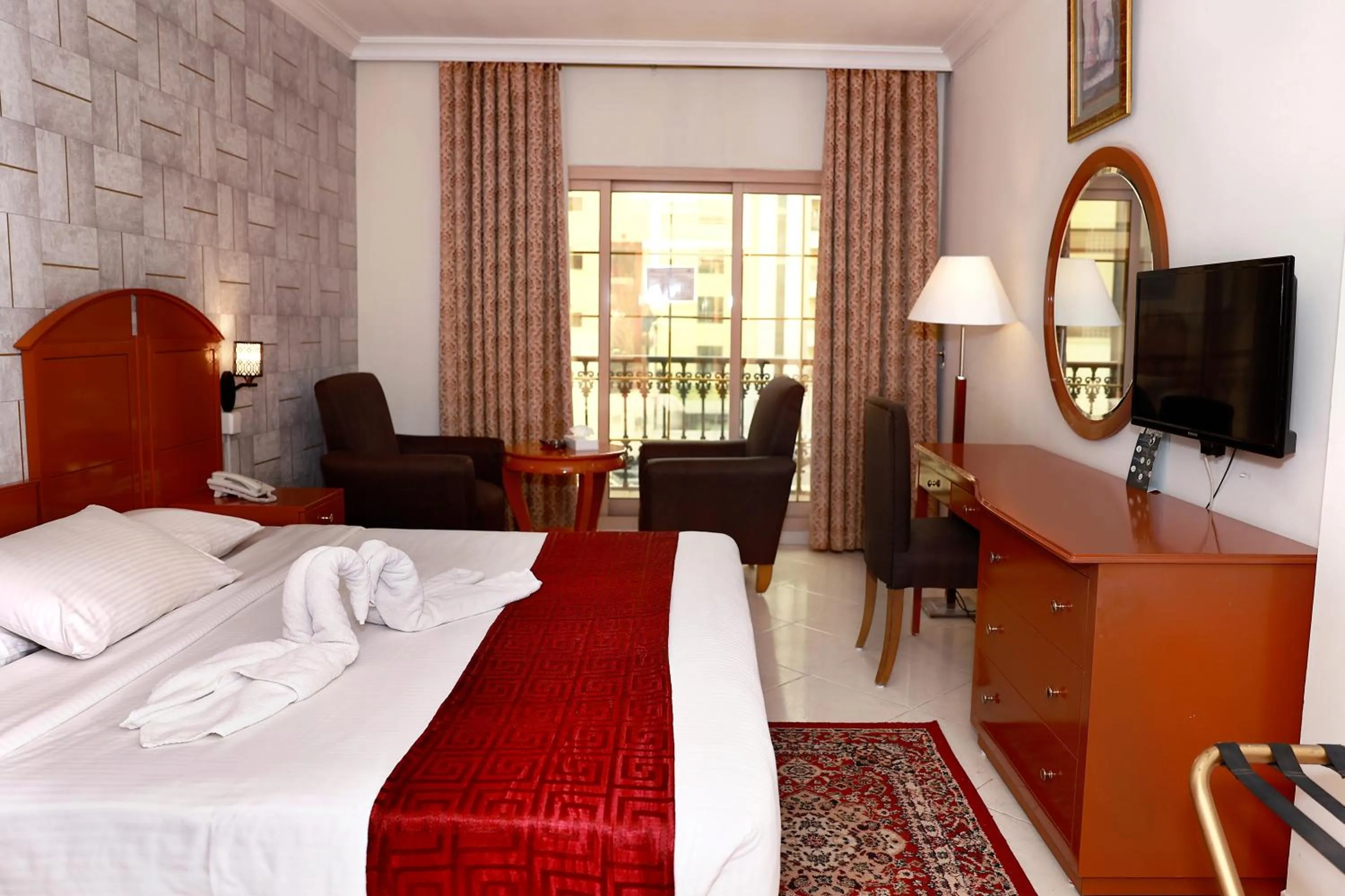 Bed in Dolphin Hotel Apartments