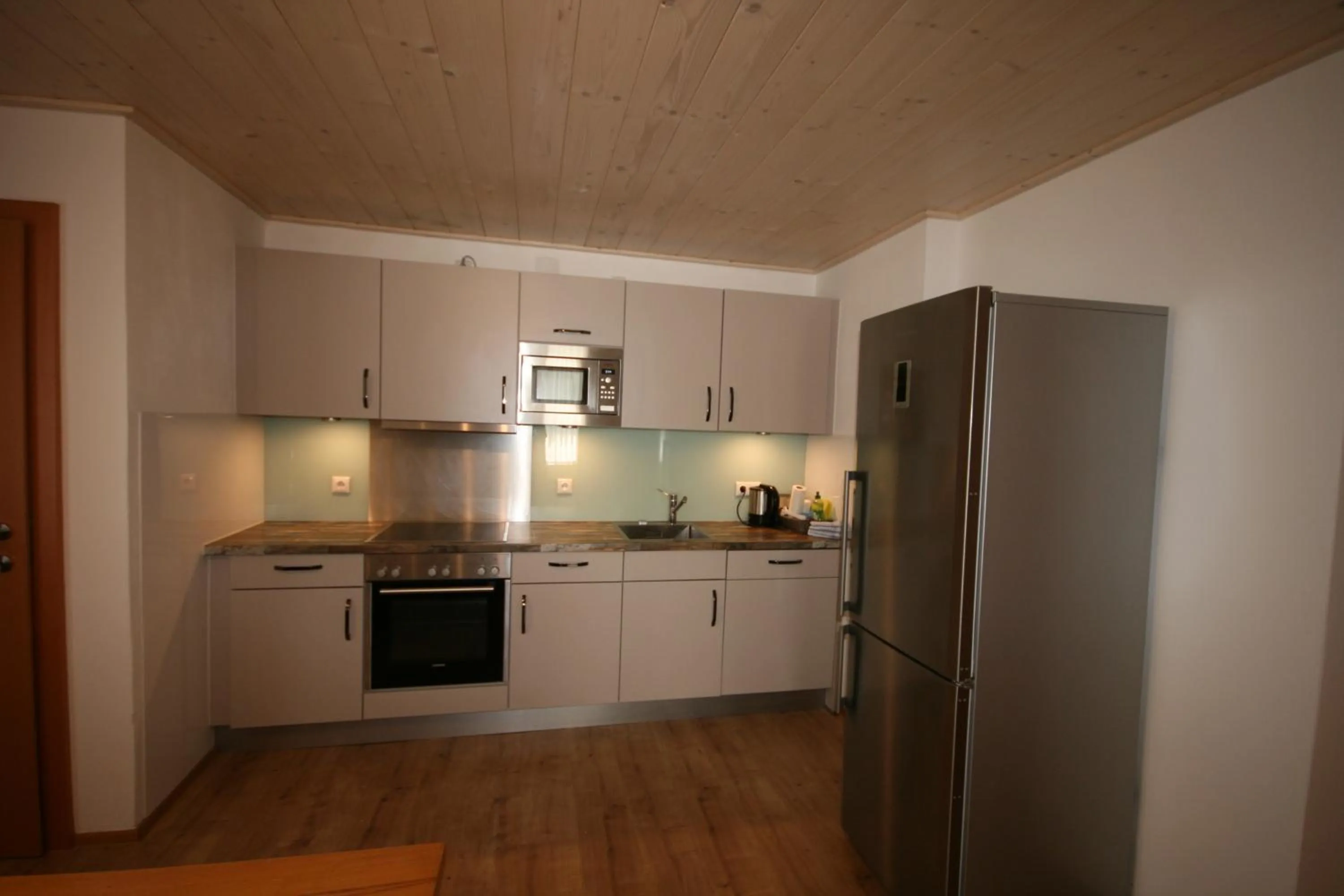 Kitchen or kitchenette in Familienappartements Eder - Free entry to Tauern SPA Kaprun included