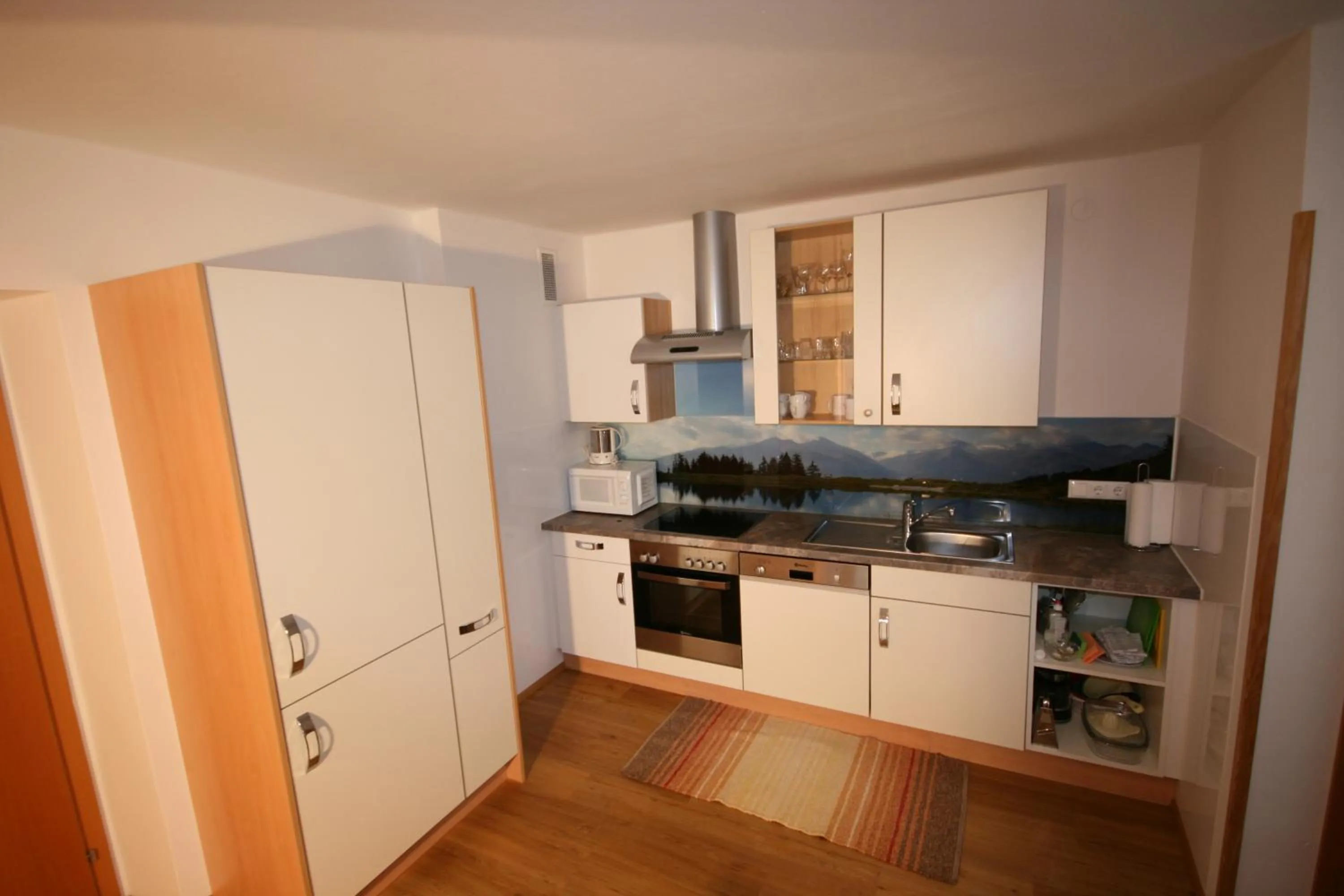 Kitchen or kitchenette in Familienappartements Eder - Free entry to Tauern SPA Kaprun included
