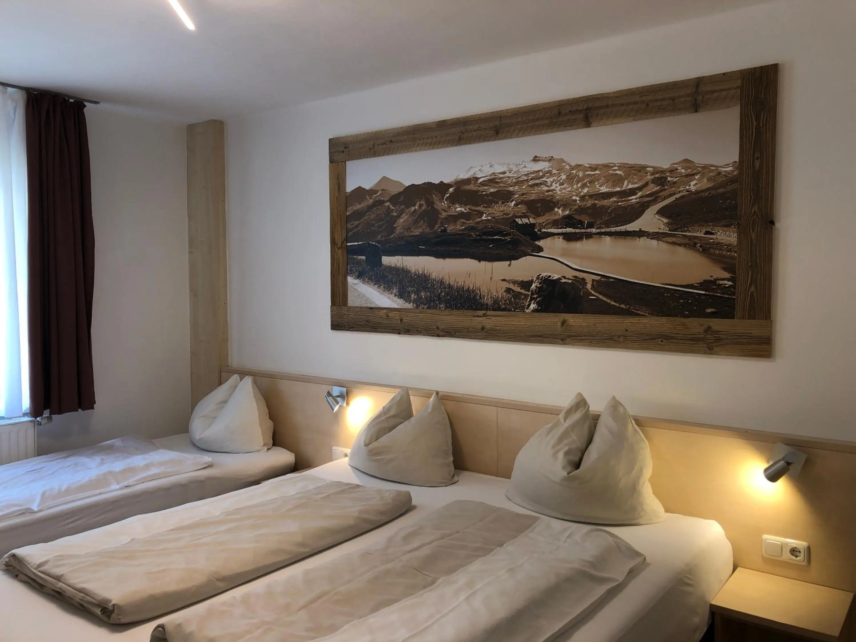 Bedroom, Bed in Familienappartements Eder - Free entry to Tauern SPA Kaprun included