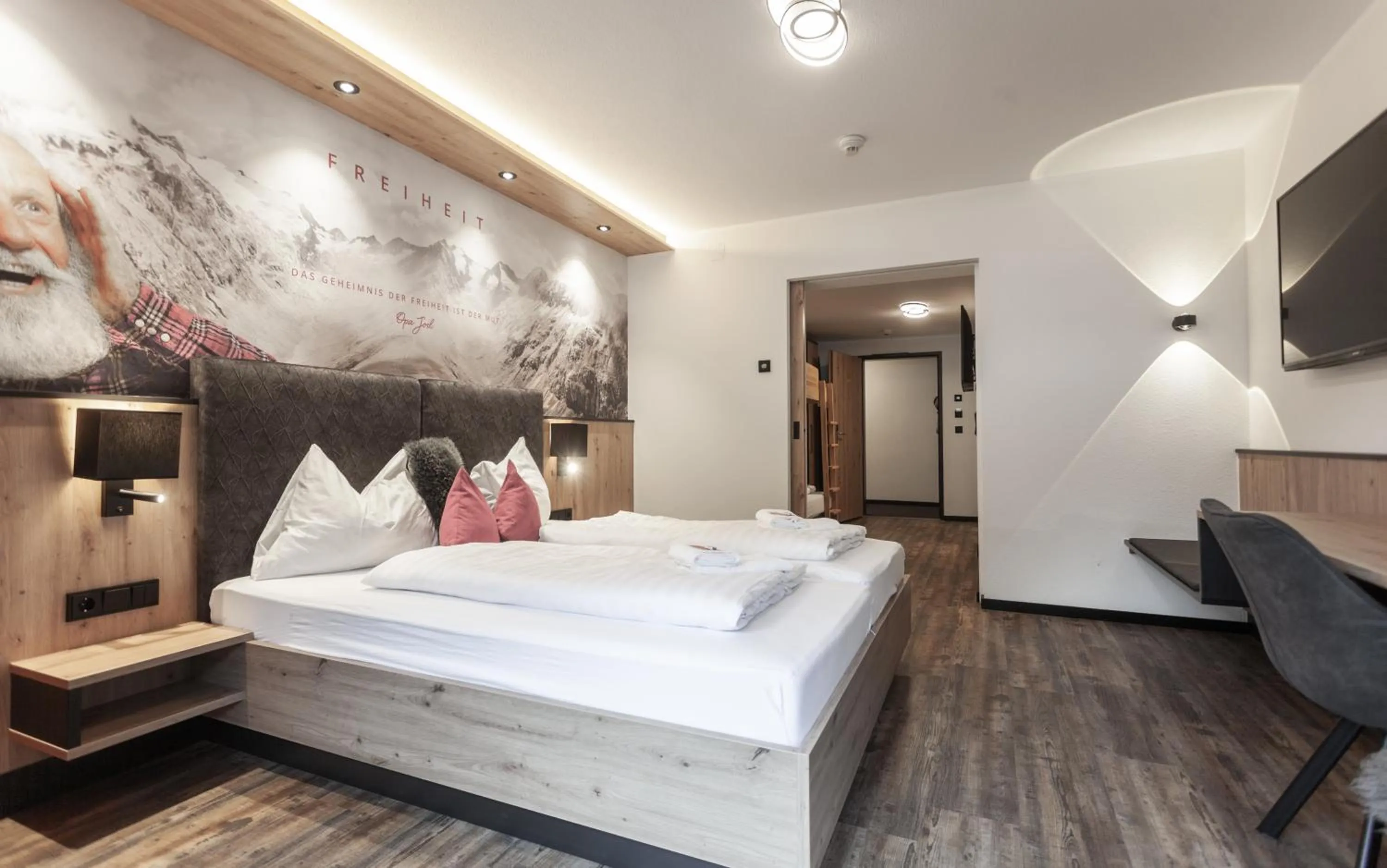 Photo of the whole room, Bed in first mountain Hotel Ötztal