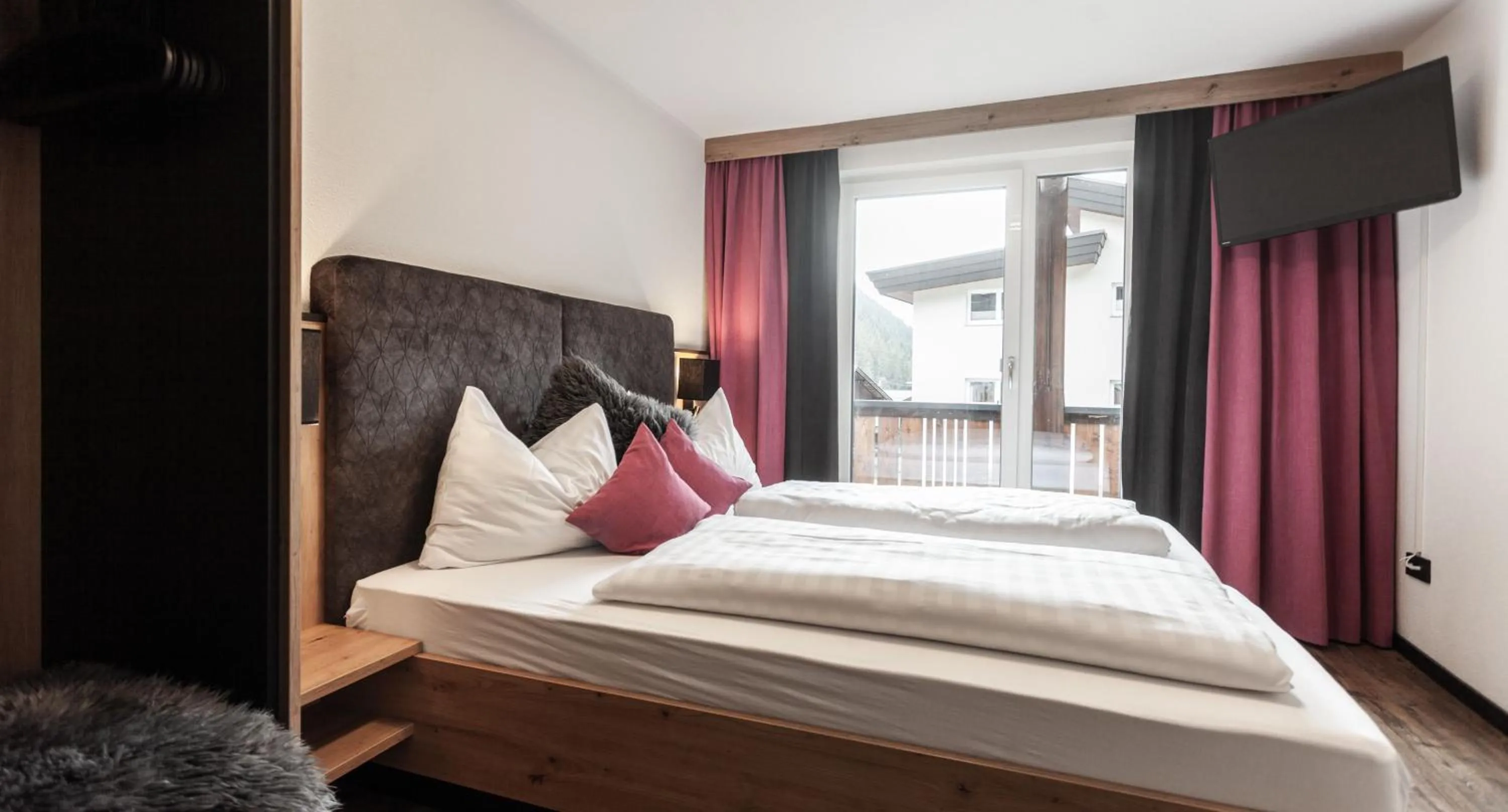 Photo of the whole room, Bed in first mountain Hotel Ötztal