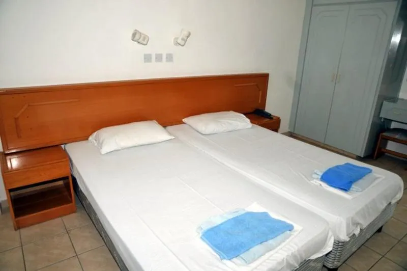 Bed in DebbieXenia Hotel Apartments Annex