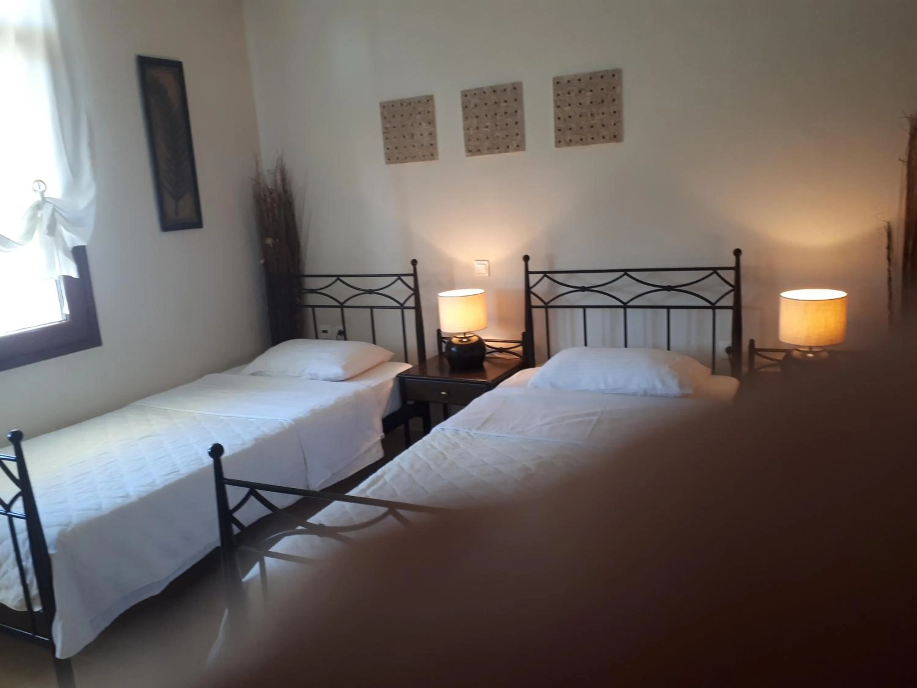 Bed in Villa Del Lago Boutique Hotel