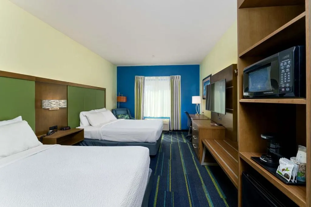 Bed in Triple Play Resort Hotel & Suites