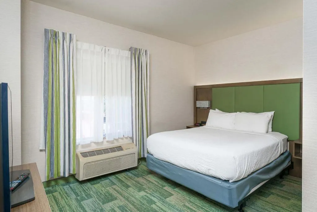 Bed in Triple Play Resort Hotel & Suites