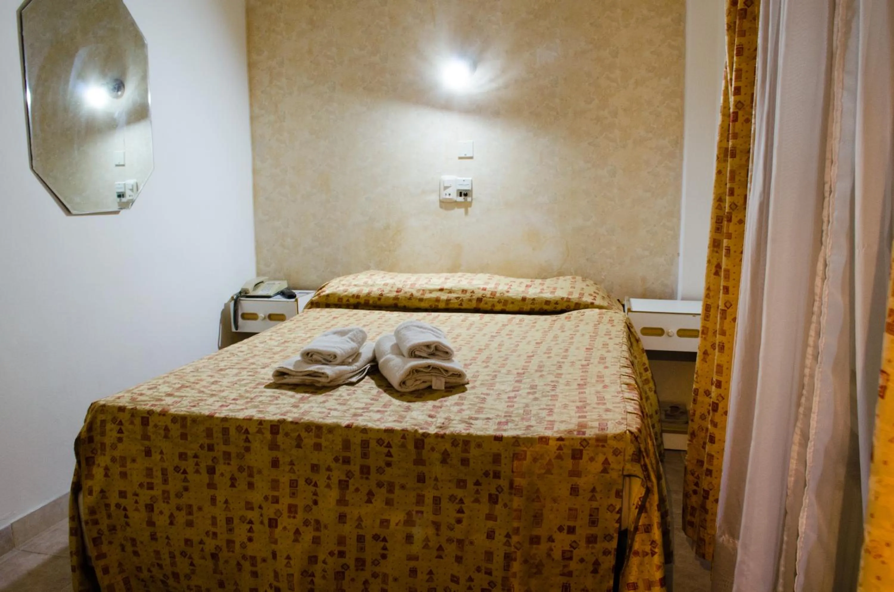 Bed in San Remo Grand Hotel