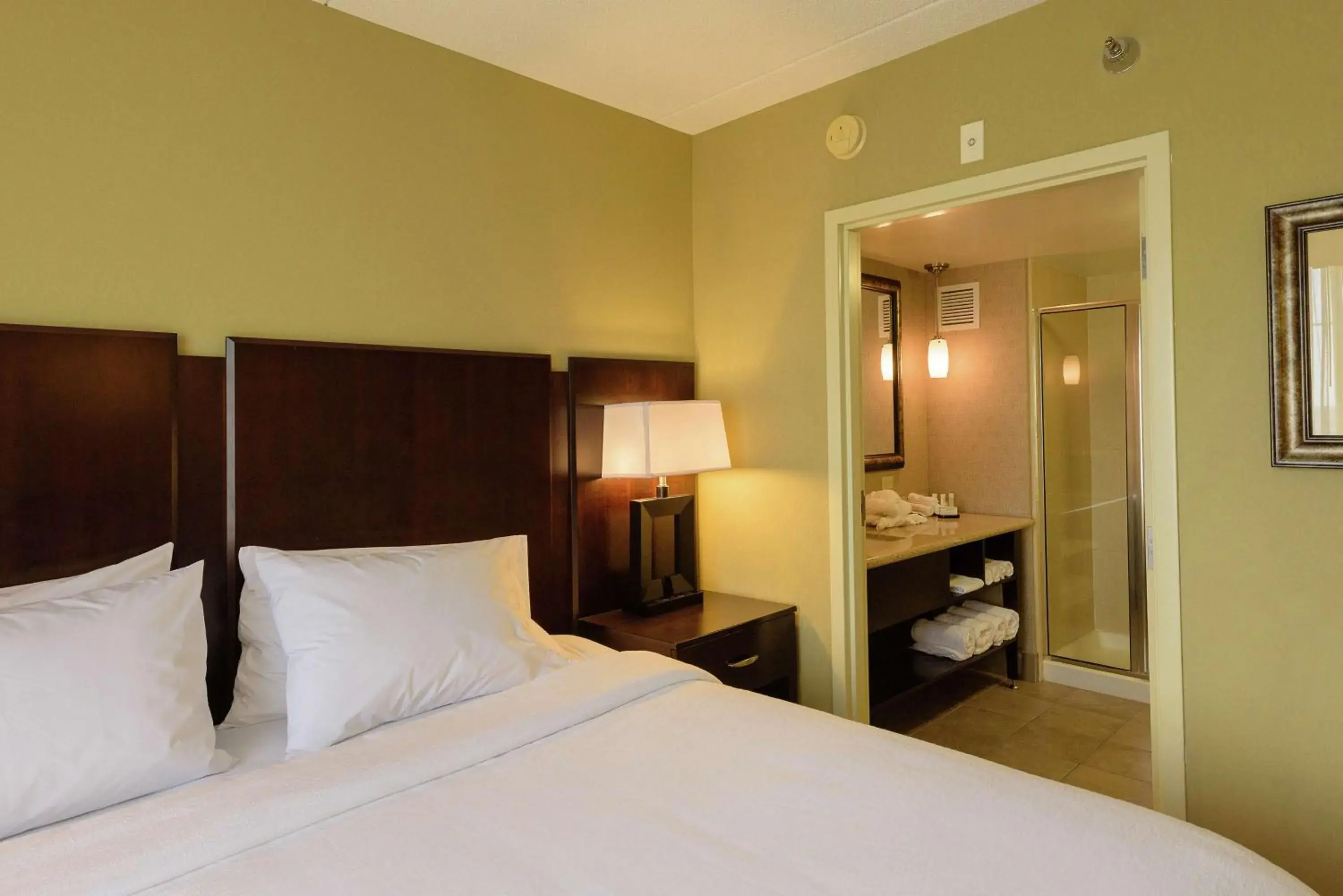 Bathroom, Bed in Embassy Suites by Hilton Minneapolis North Bathroom, Bed in Embassy Suites by Hilton Minneapolis North