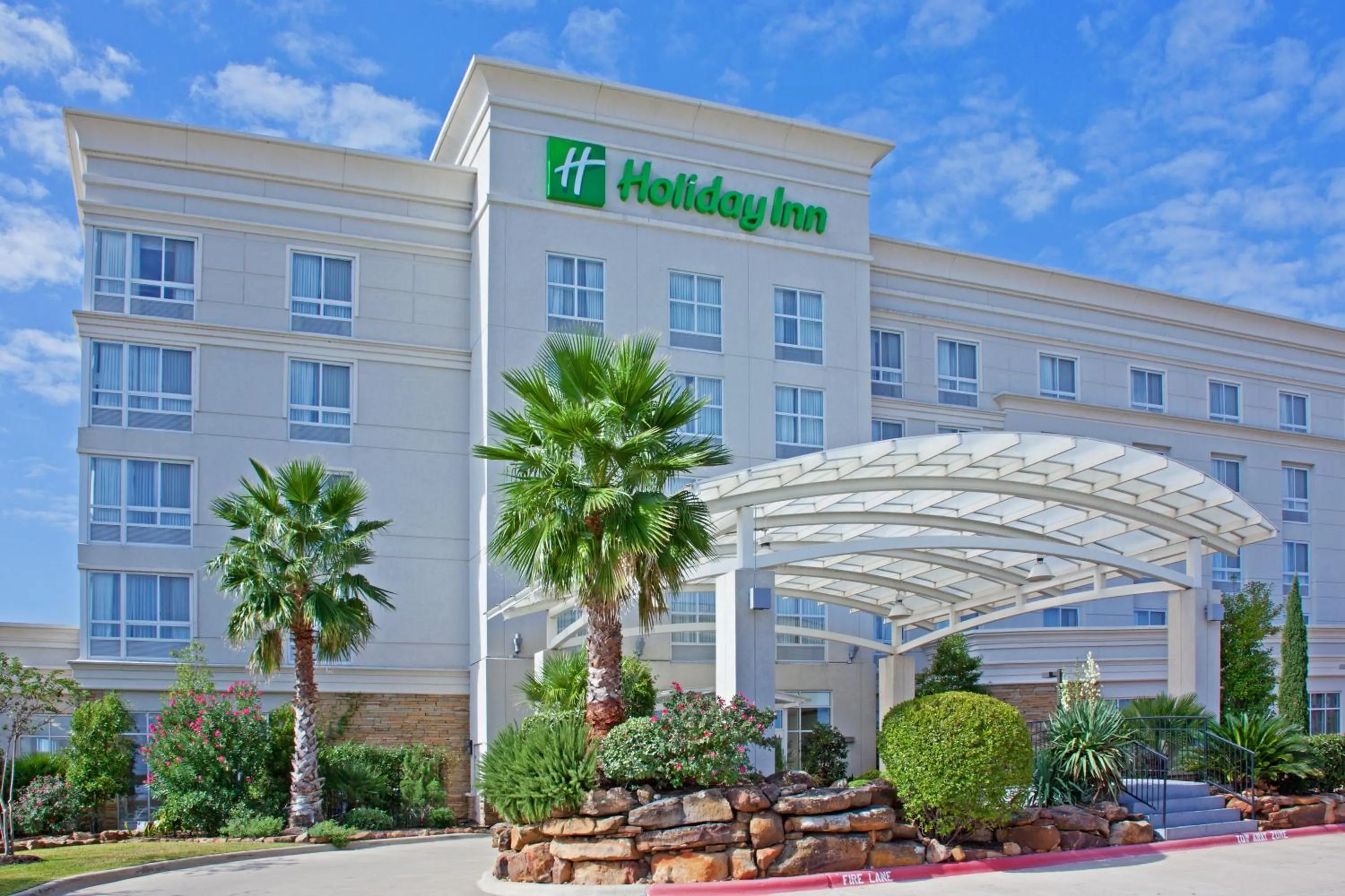 Property building in Holiday Inn & Suites College Station-Aggieland by IHG