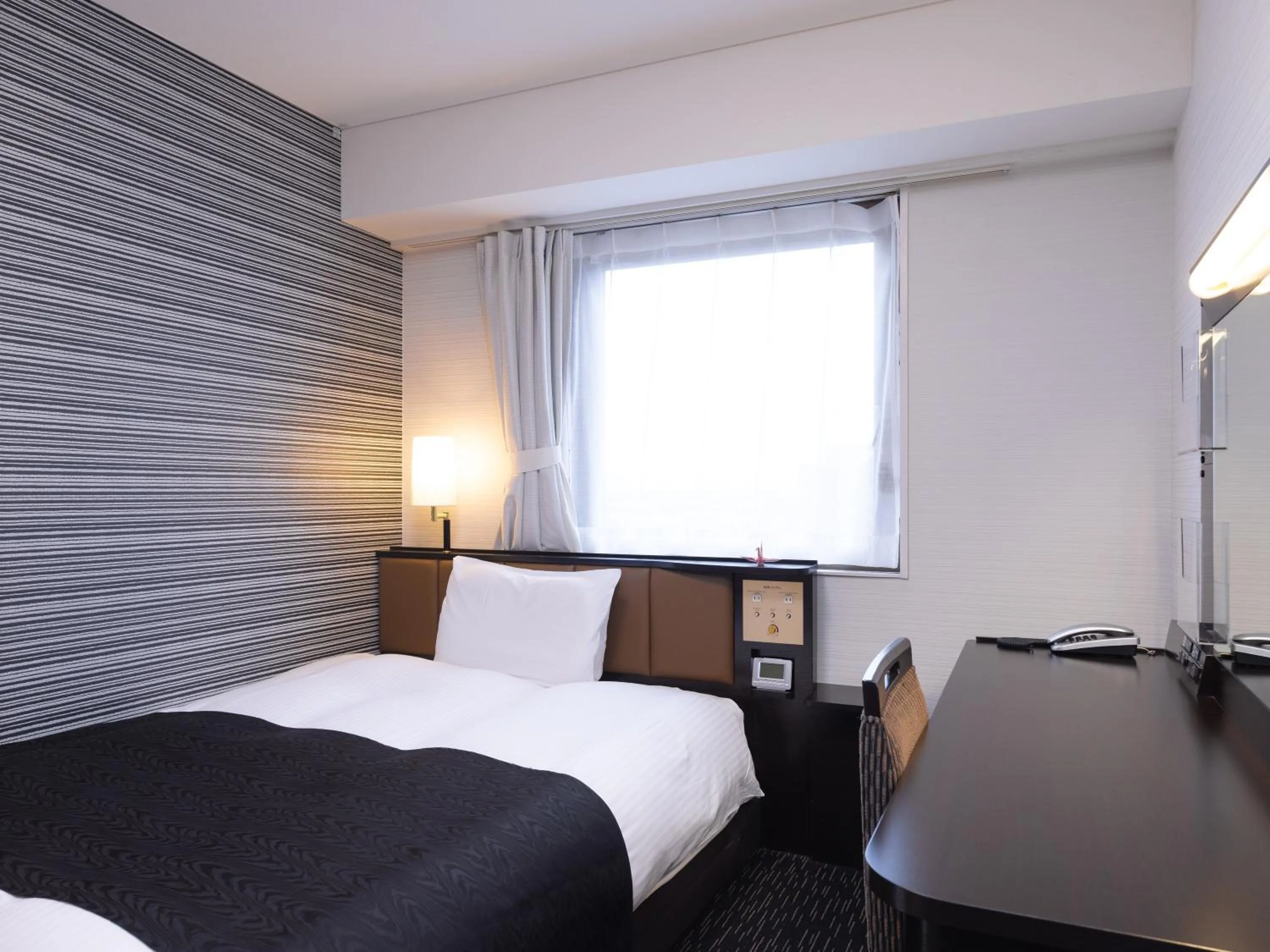 Bed in APA Hotel Yamagata Tsuruoka Ekimae