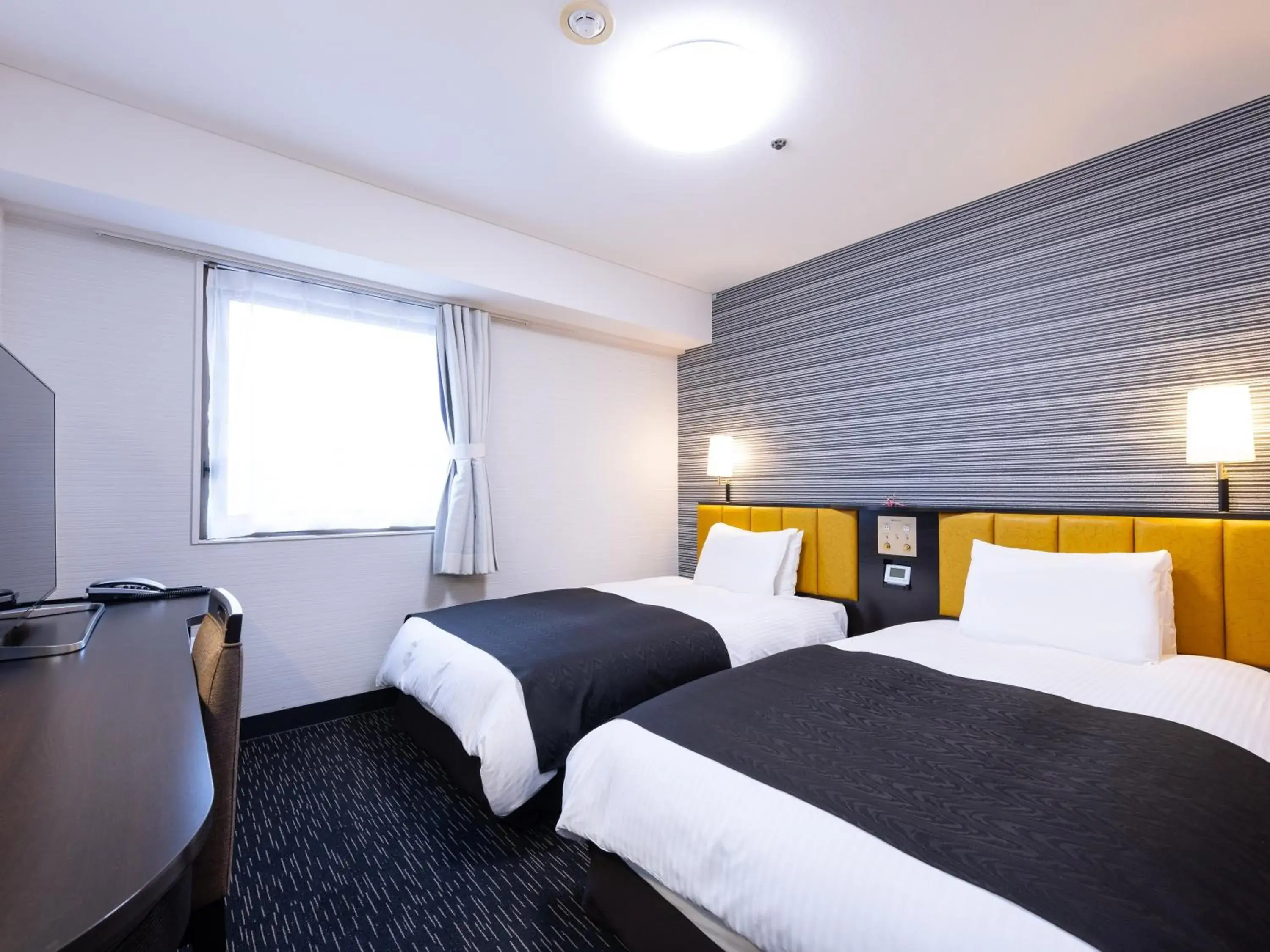 Bed in APA Hotel Yamagata Tsuruoka Ekimae Bed in APA Hotel Yamagata Tsuruoka Ekimae