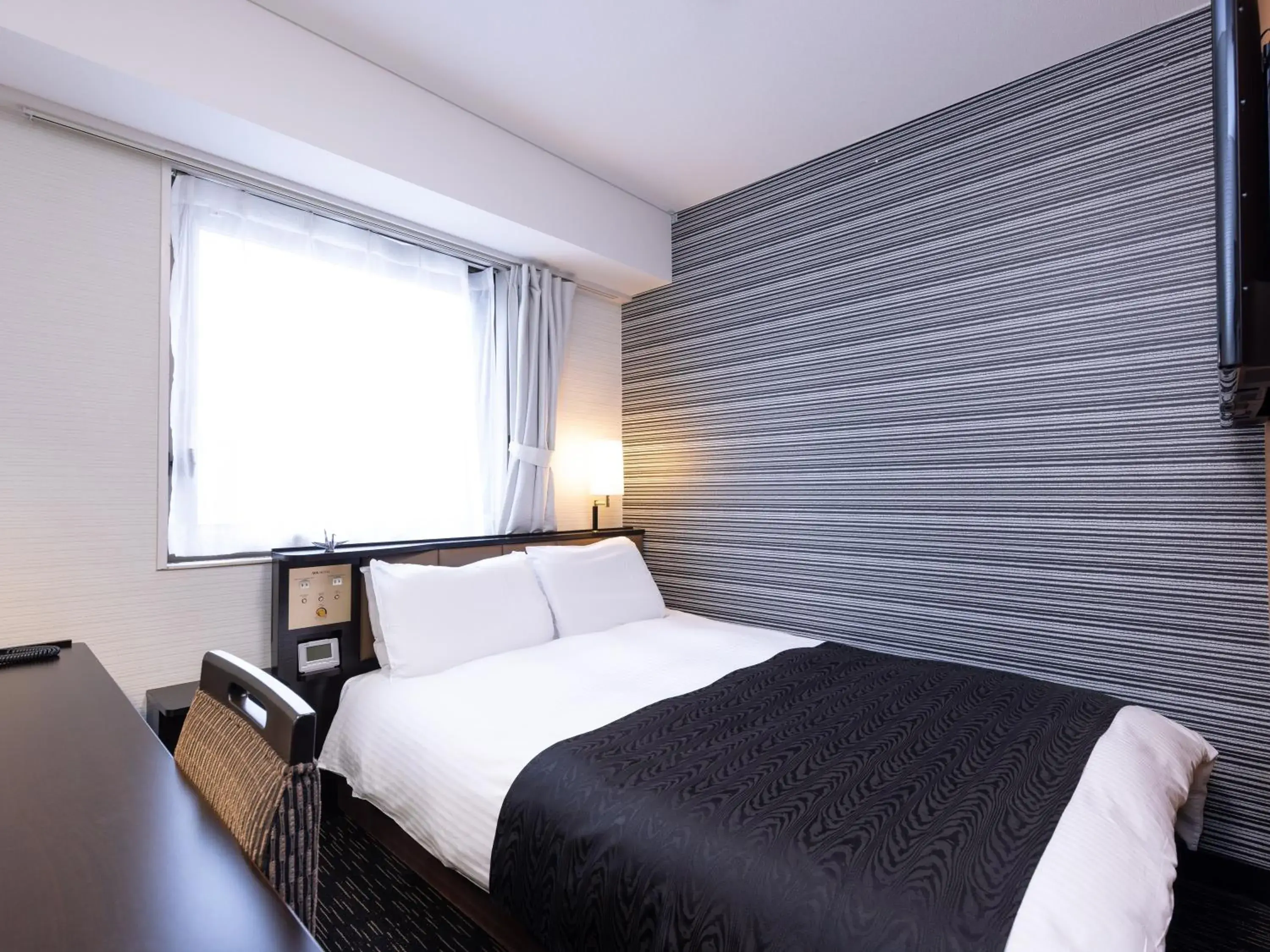 Bed in APA Hotel Yamagata Tsuruoka Ekimae Bed in APA Hotel Yamagata Tsuruoka Ekimae