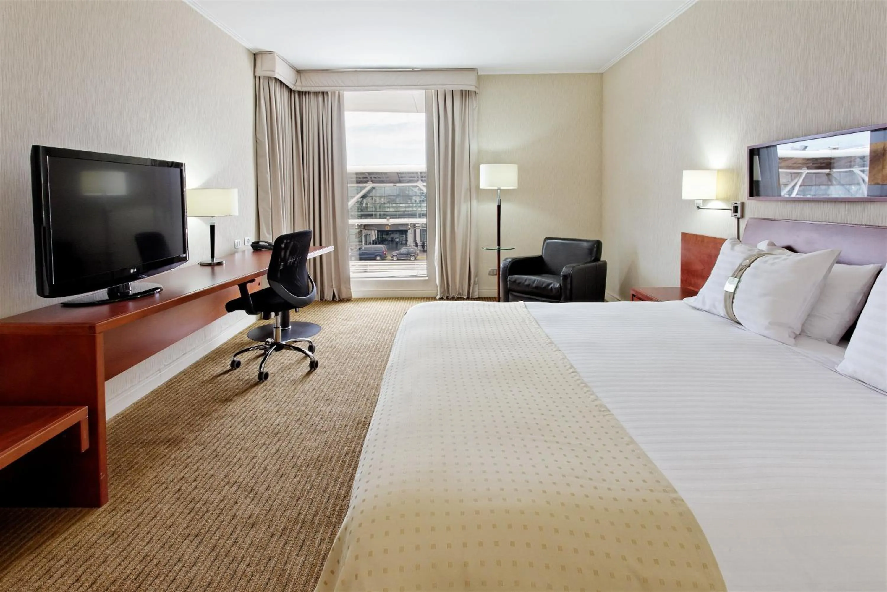 Photo of the whole room, Bed in Holiday Inn Santiago - Airport Terminal by IHG