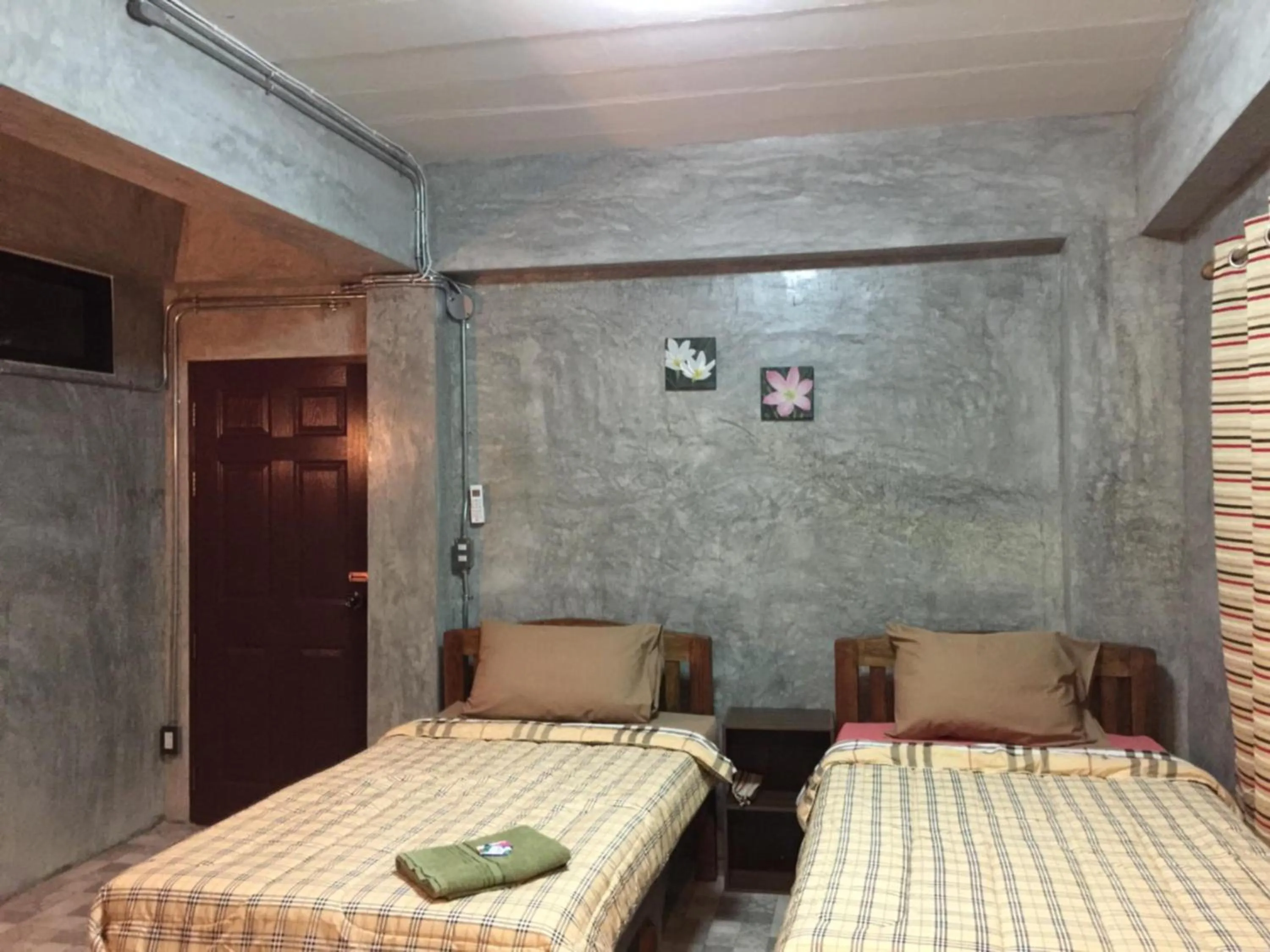 Bed in Chiangmai HomeTeL