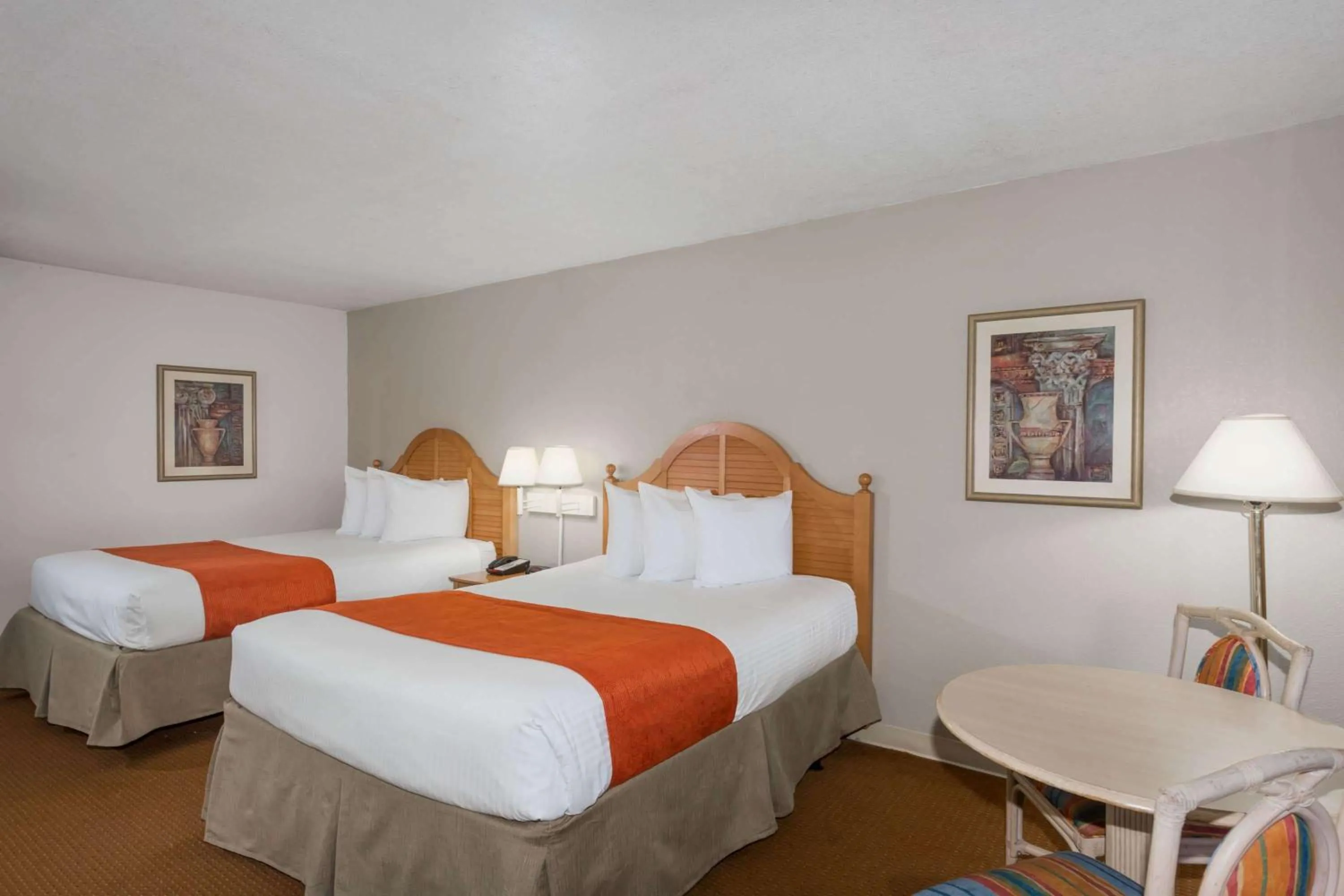 Photo of the whole room, Bed in Ramada by Wyndham Kissimmee Gateway - Free Theme Park Shuttle
