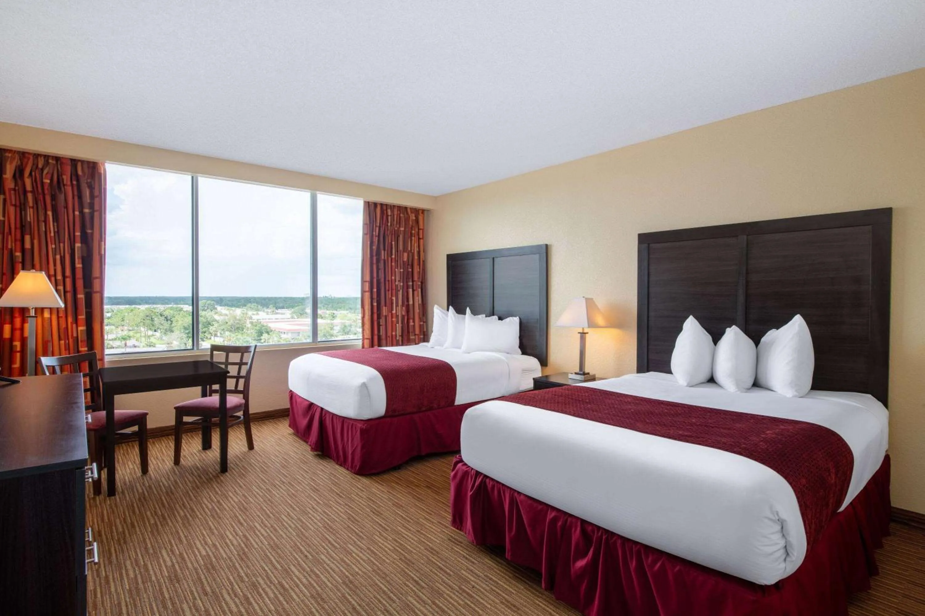 Photo of the whole room, Bed in Ramada by Wyndham Kissimmee Gateway - Free Theme Park Shuttle