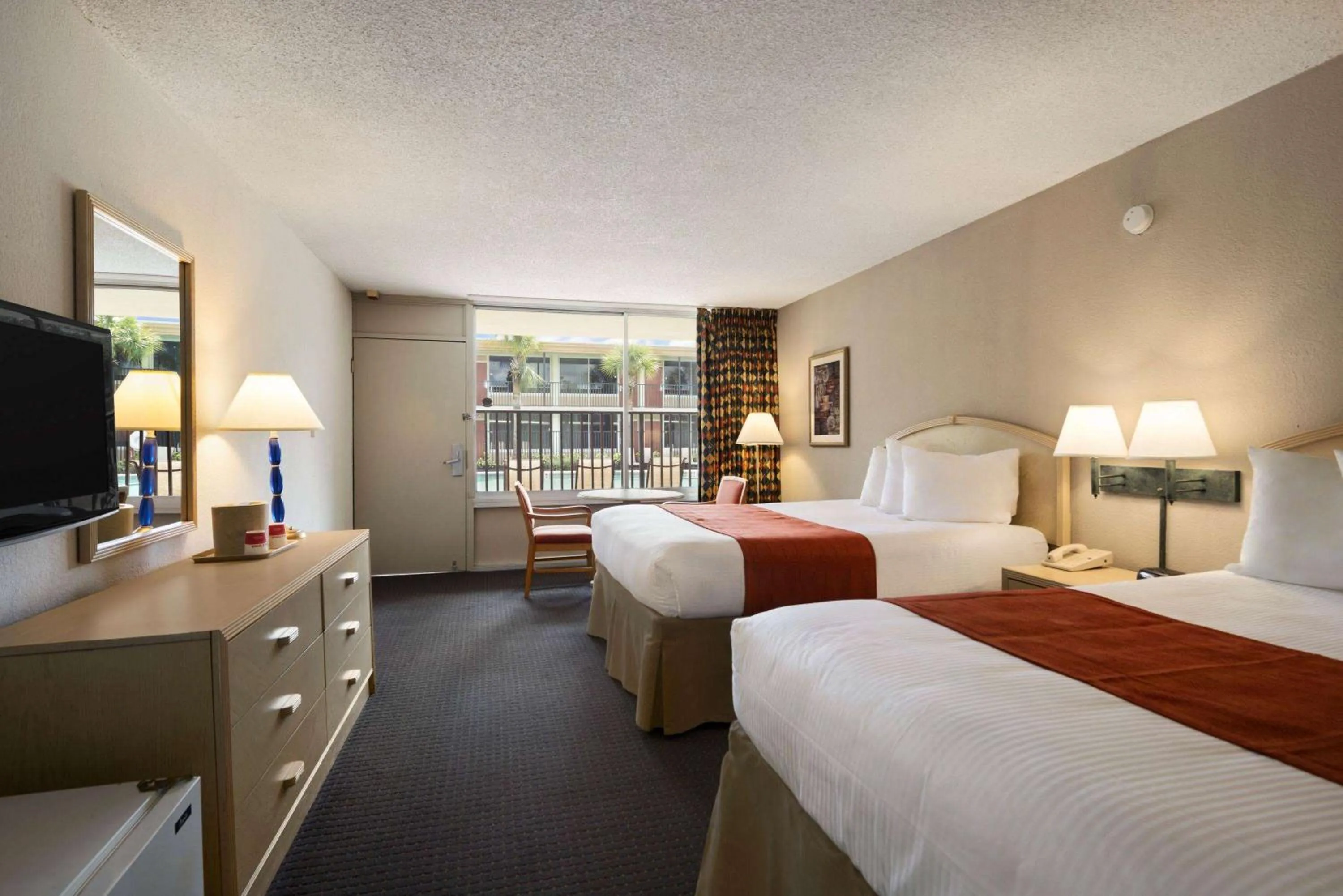 Photo of the whole room, Bed in Ramada by Wyndham Kissimmee Gateway - Free Theme Park Shuttle