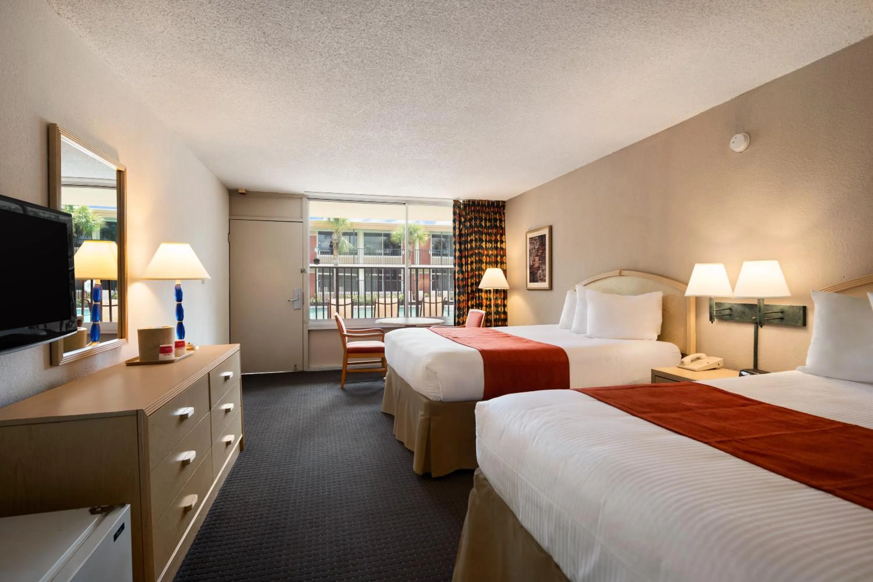 Photo of the whole room, Bed in Ramada by Wyndham Kissimmee Gateway - Free Theme Park Shuttle