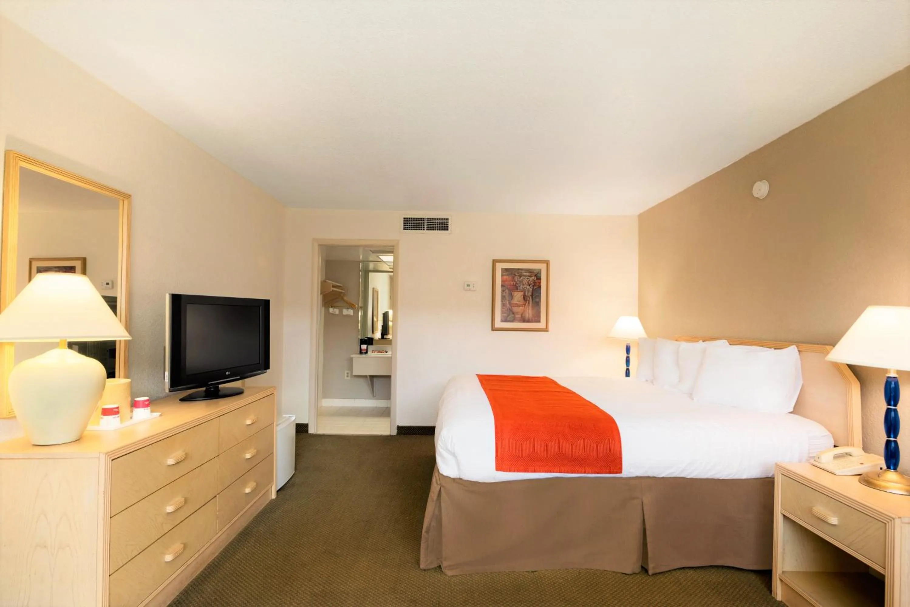 Photo of the whole room, Bed in Ramada by Wyndham Kissimmee Gateway - Free Theme Park Shuttle