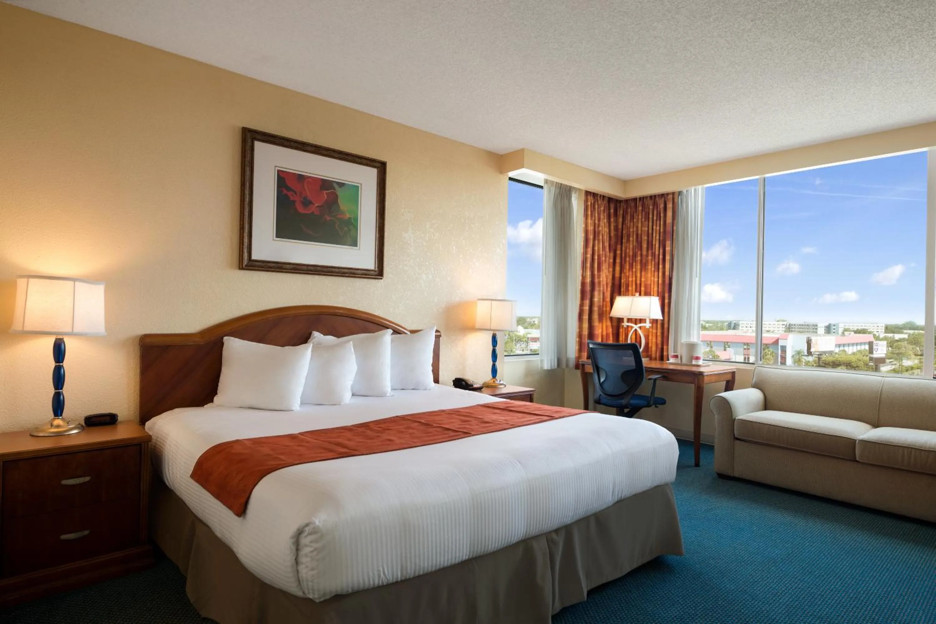 Bed in Ramada by Wyndham Kissimmee Gateway - Free Theme Park Shuttle