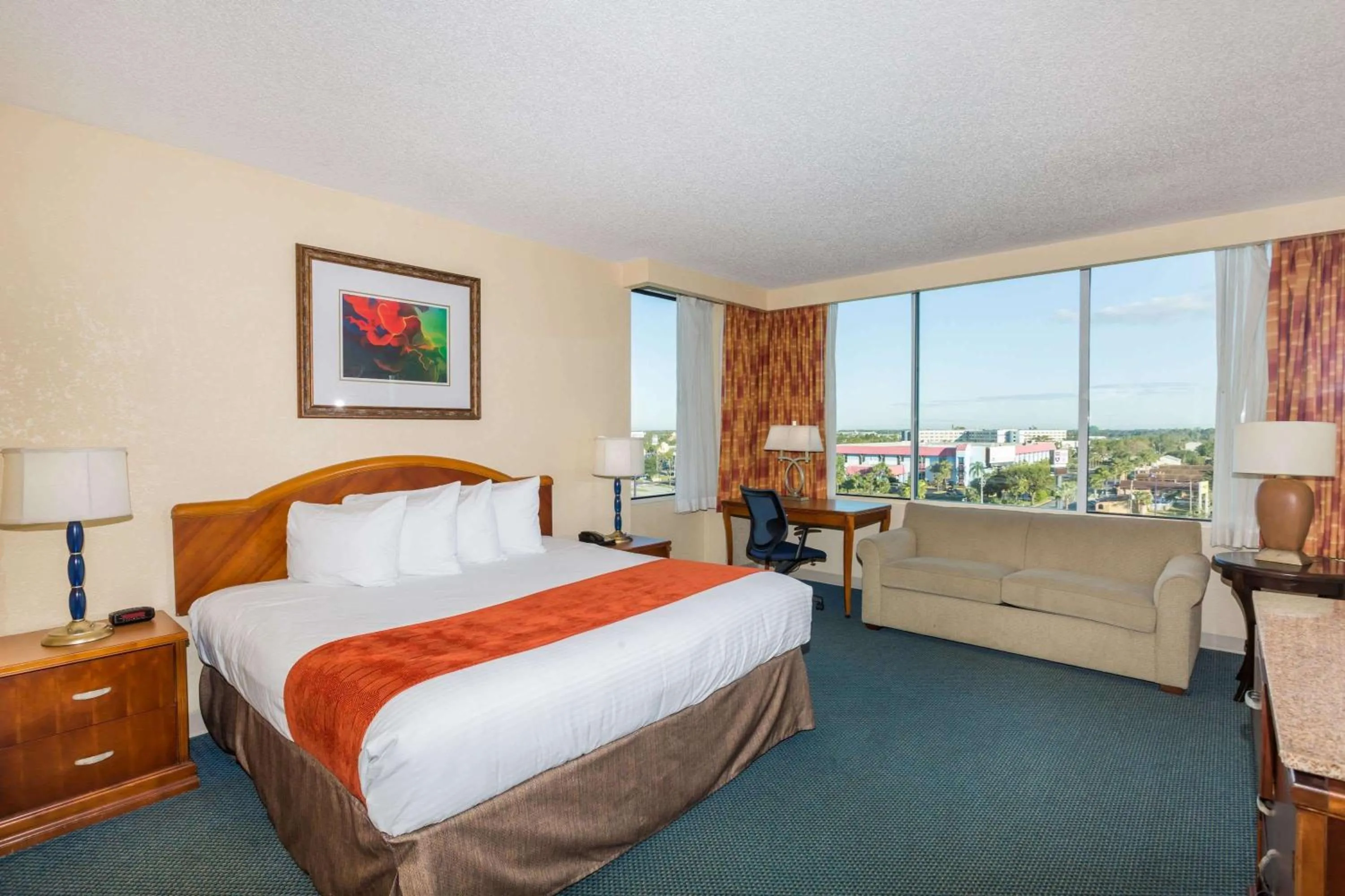Photo of the whole room, Bed in Ramada by Wyndham Kissimmee Gateway - Free Theme Park Shuttle