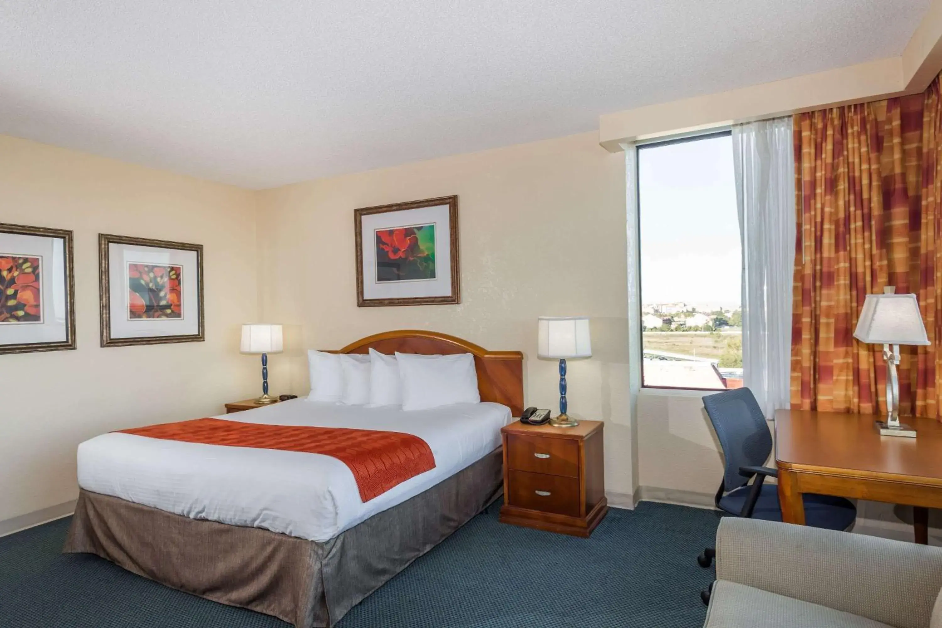 Photo of the whole room, Bed in Ramada by Wyndham Kissimmee Gateway - Free Theme Park Shuttle Photo of the whole room, Bed in Ramada by Wyndham Kissimmee Gateway - Free Theme Park Shuttle