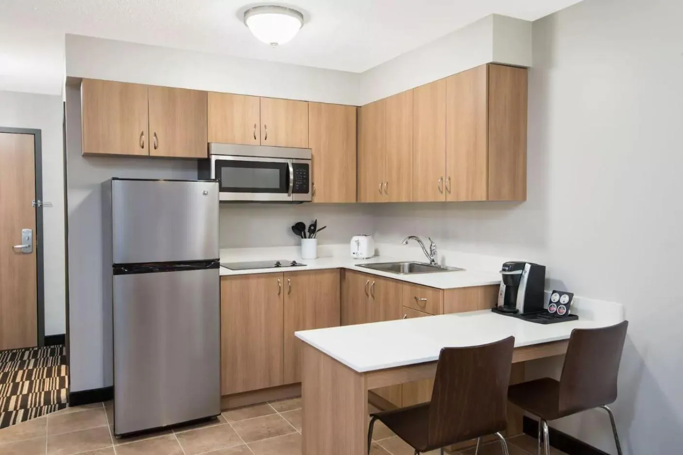 Kitchen or kitchenette in Microtel Inn & Suites by Wyndham Sudbury