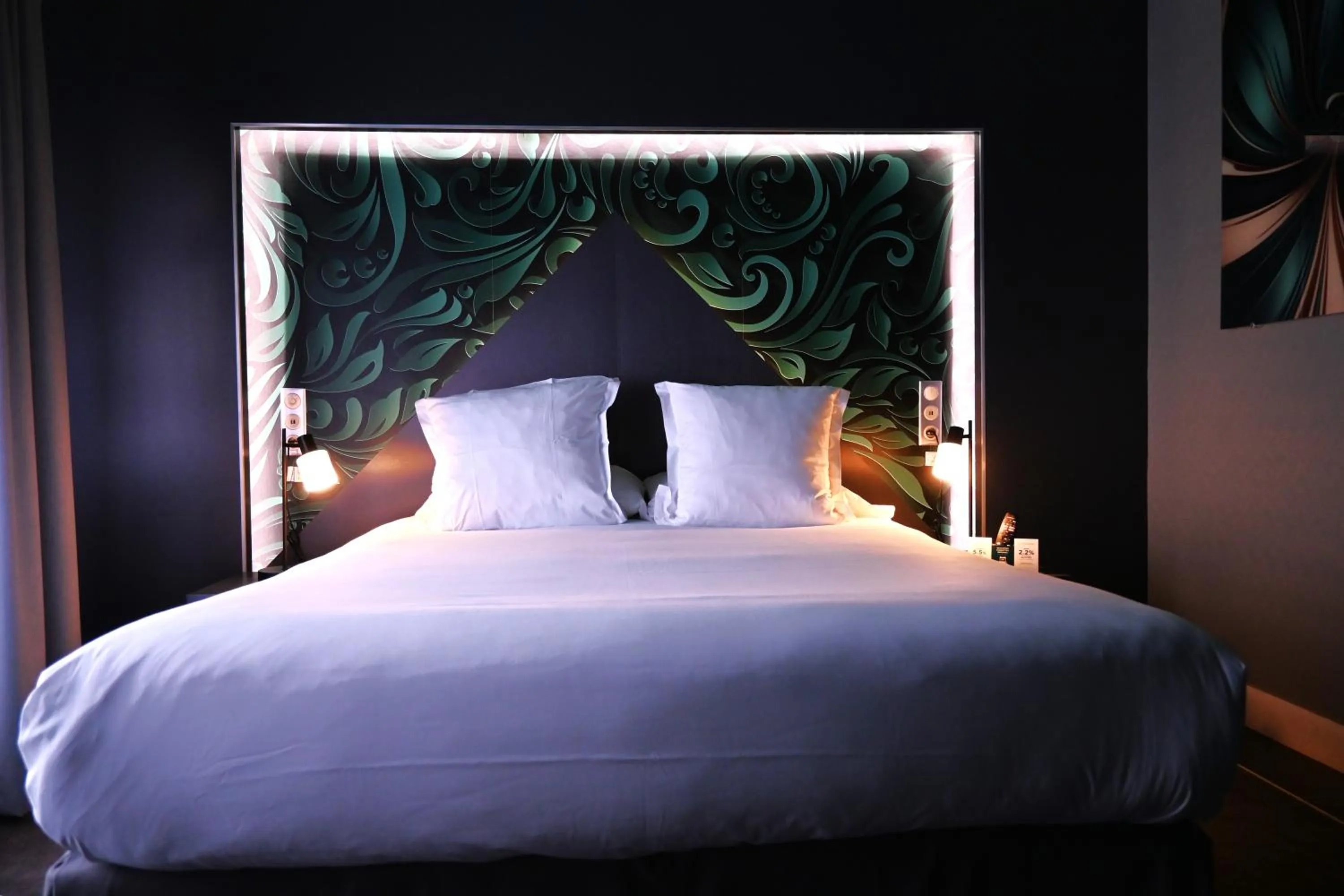 Bed in LOGIS Hôtel Borel