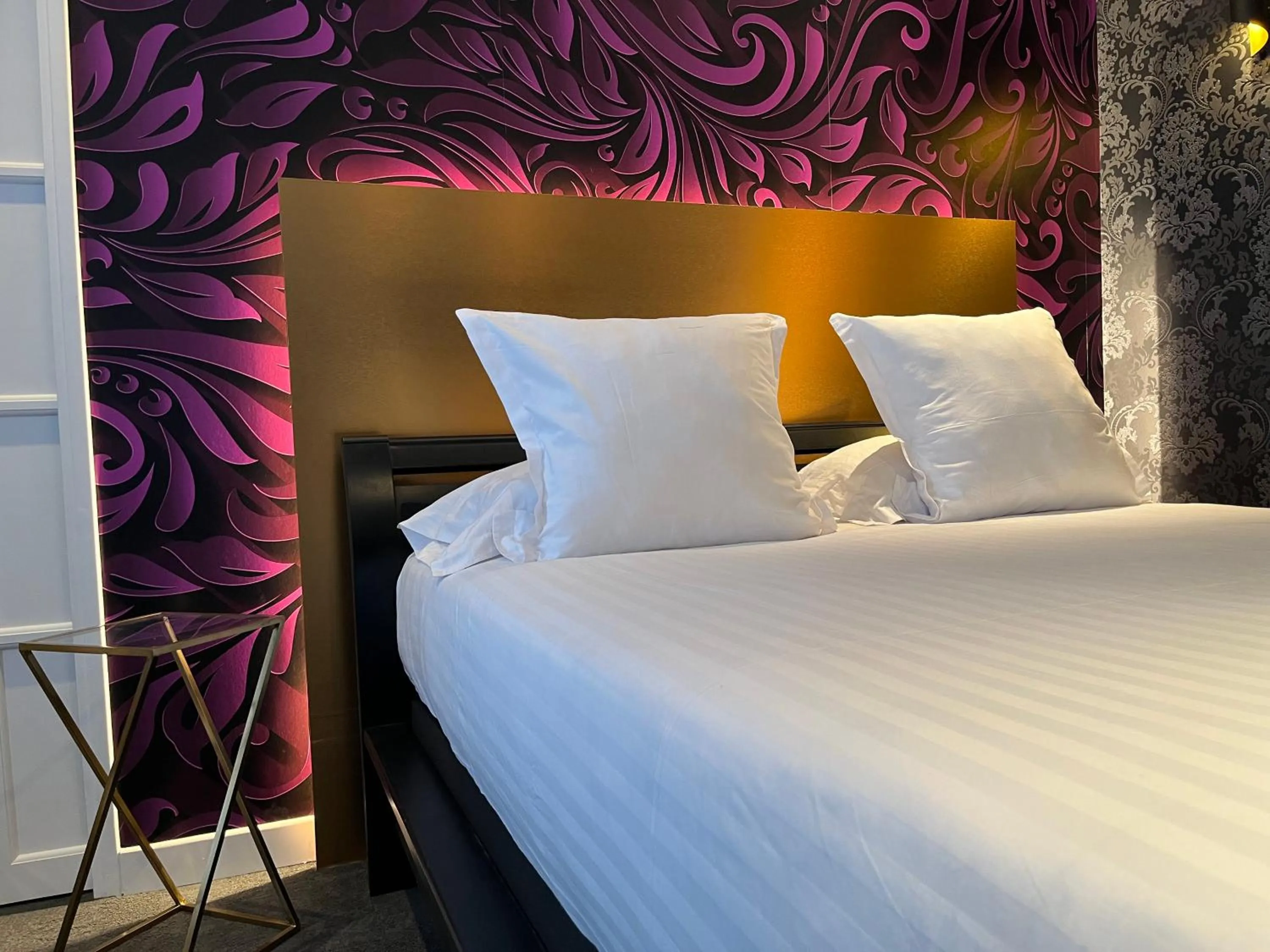 Bed in LOGIS Hôtel Borel