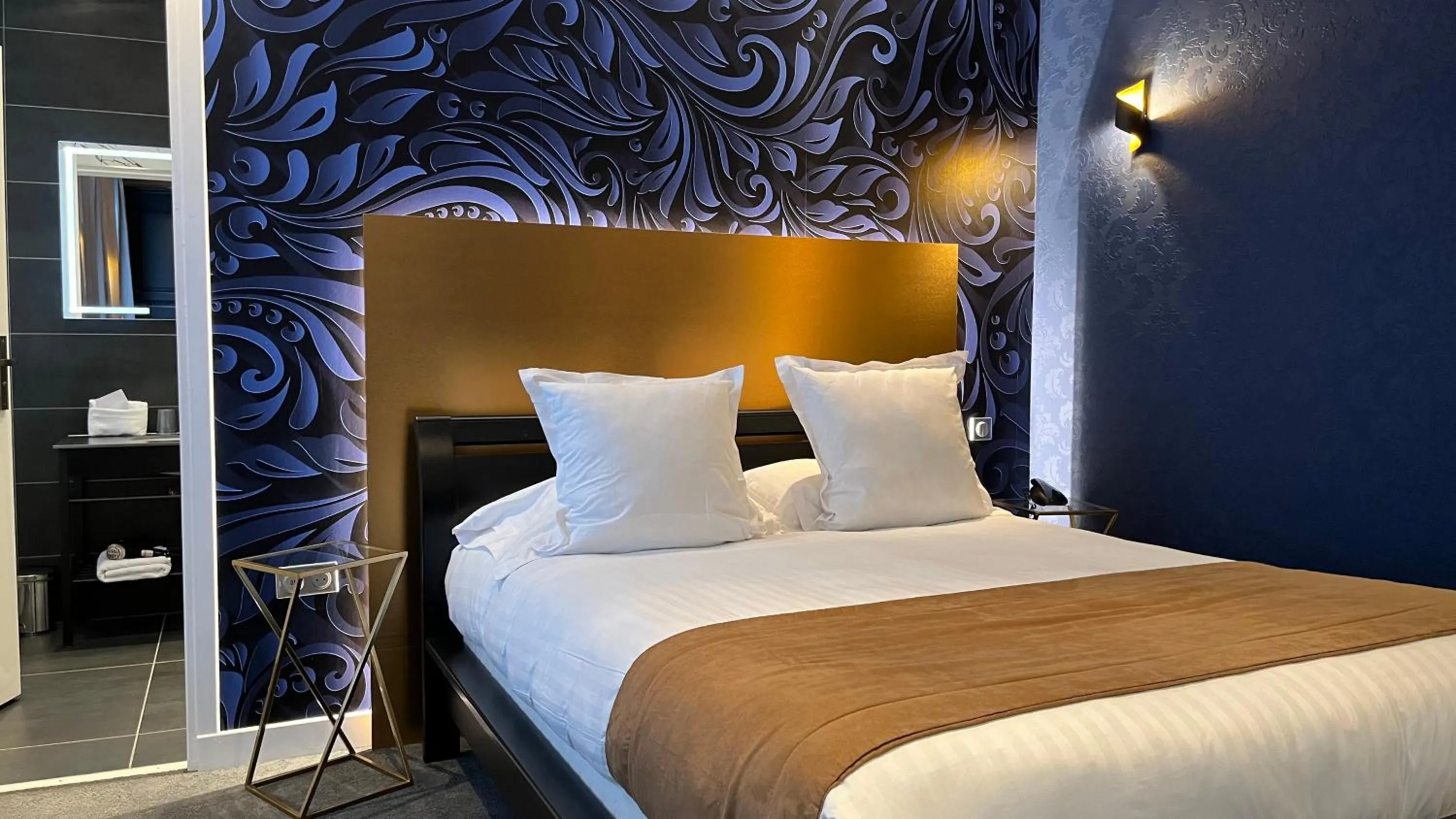 Bed in LOGIS Hôtel Borel