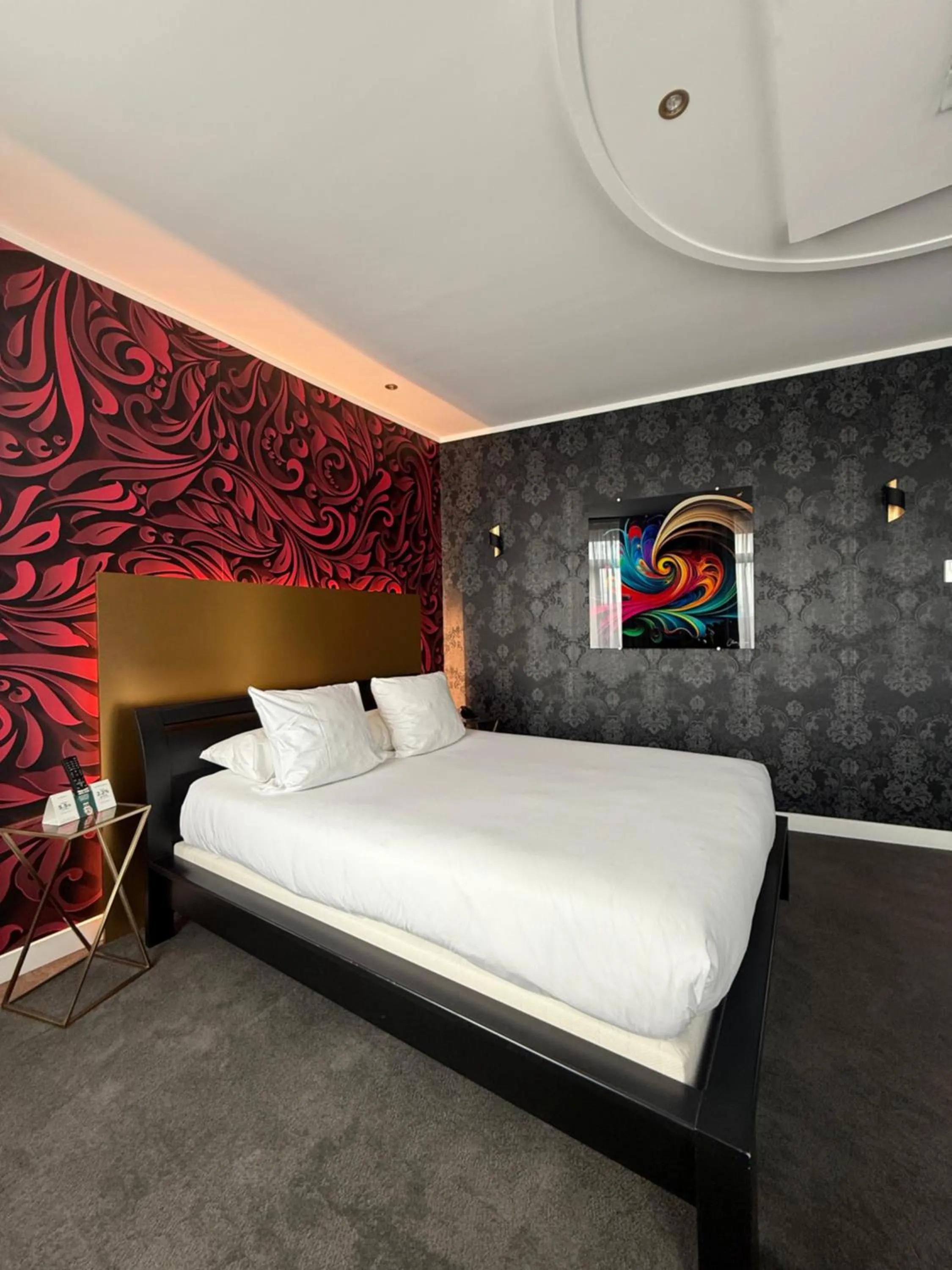 Bed in LOGIS Hôtel Borel