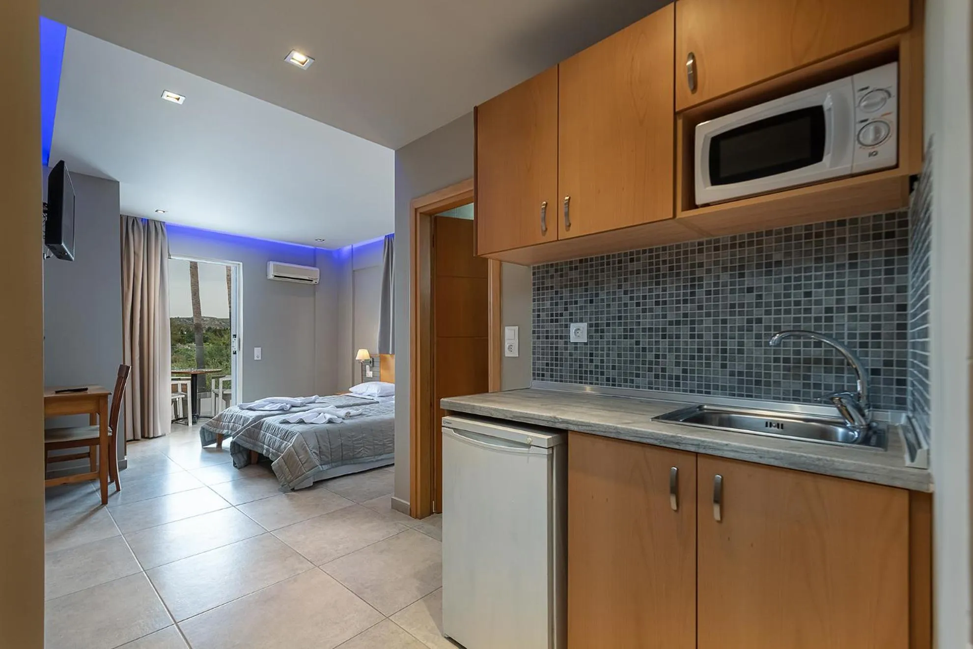 Kitchen or kitchenette, Bed in Argiri Resort Hotel & Apartments