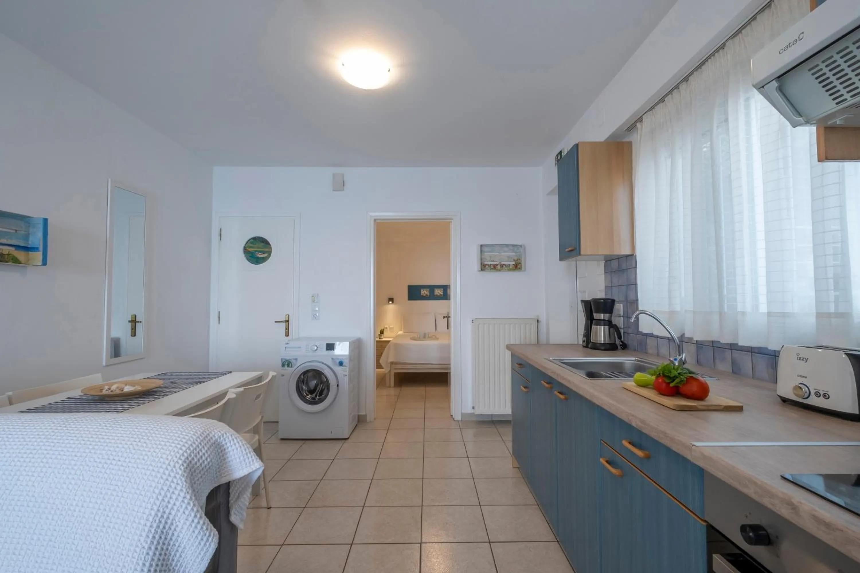 Kitchen or kitchenette, Bed in Meli Apartments & Villas