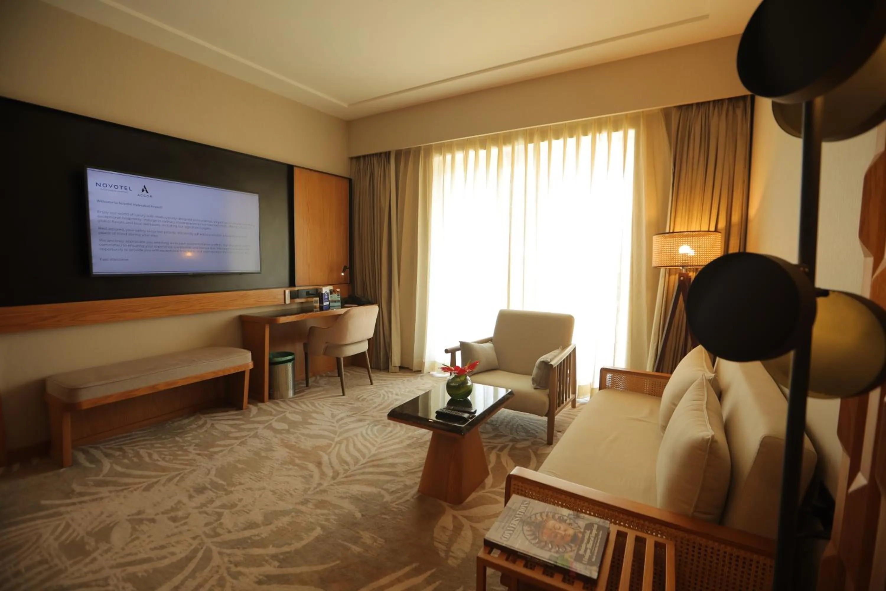 Communal lounge/ TV room in Novotel Hyderabad Airport