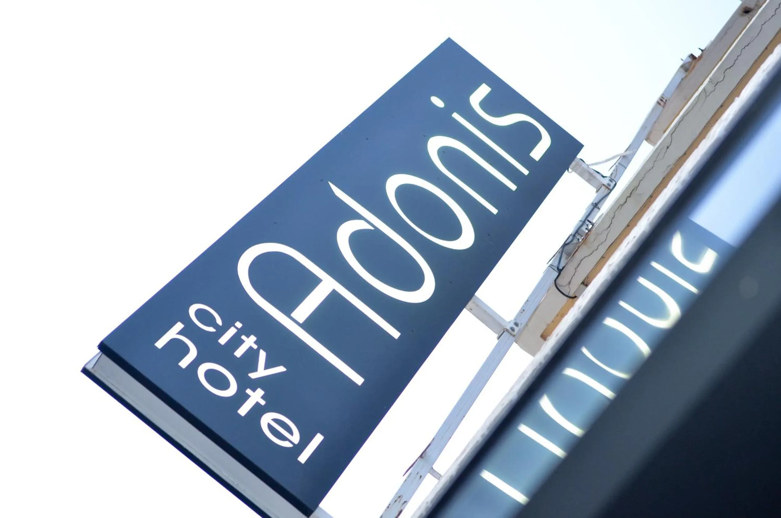 Property logo or sign in Adonis City Hotel