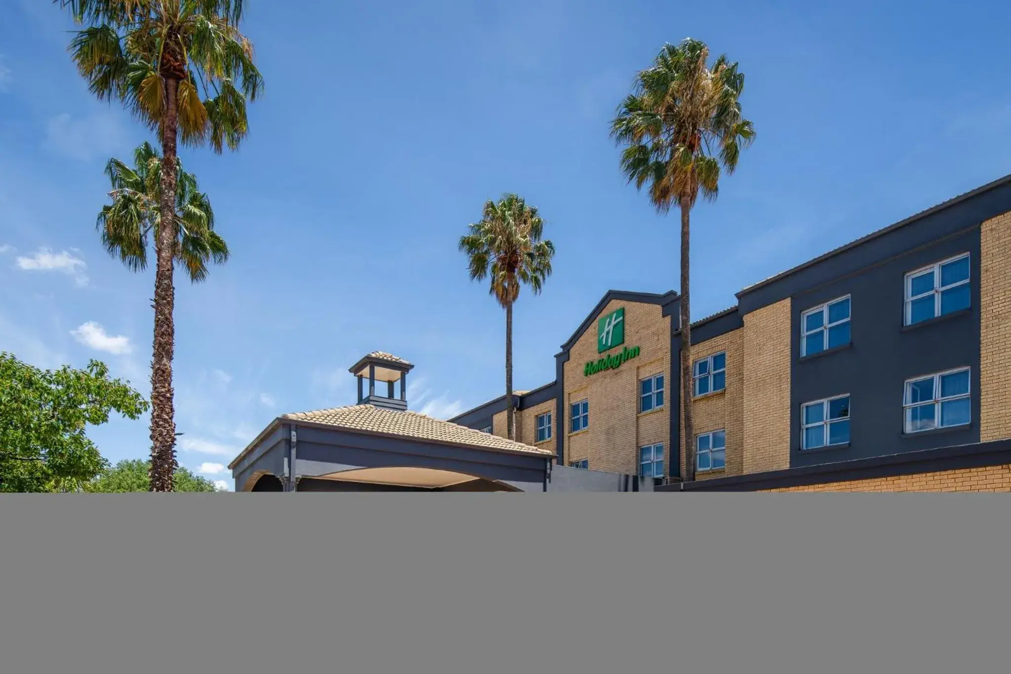 Property building in Holiday Inn Johannesburg OR Tambo Airport Hotel by IHG Property building in Holiday Inn Johannesburg OR Tambo Airport Hotel by IHG