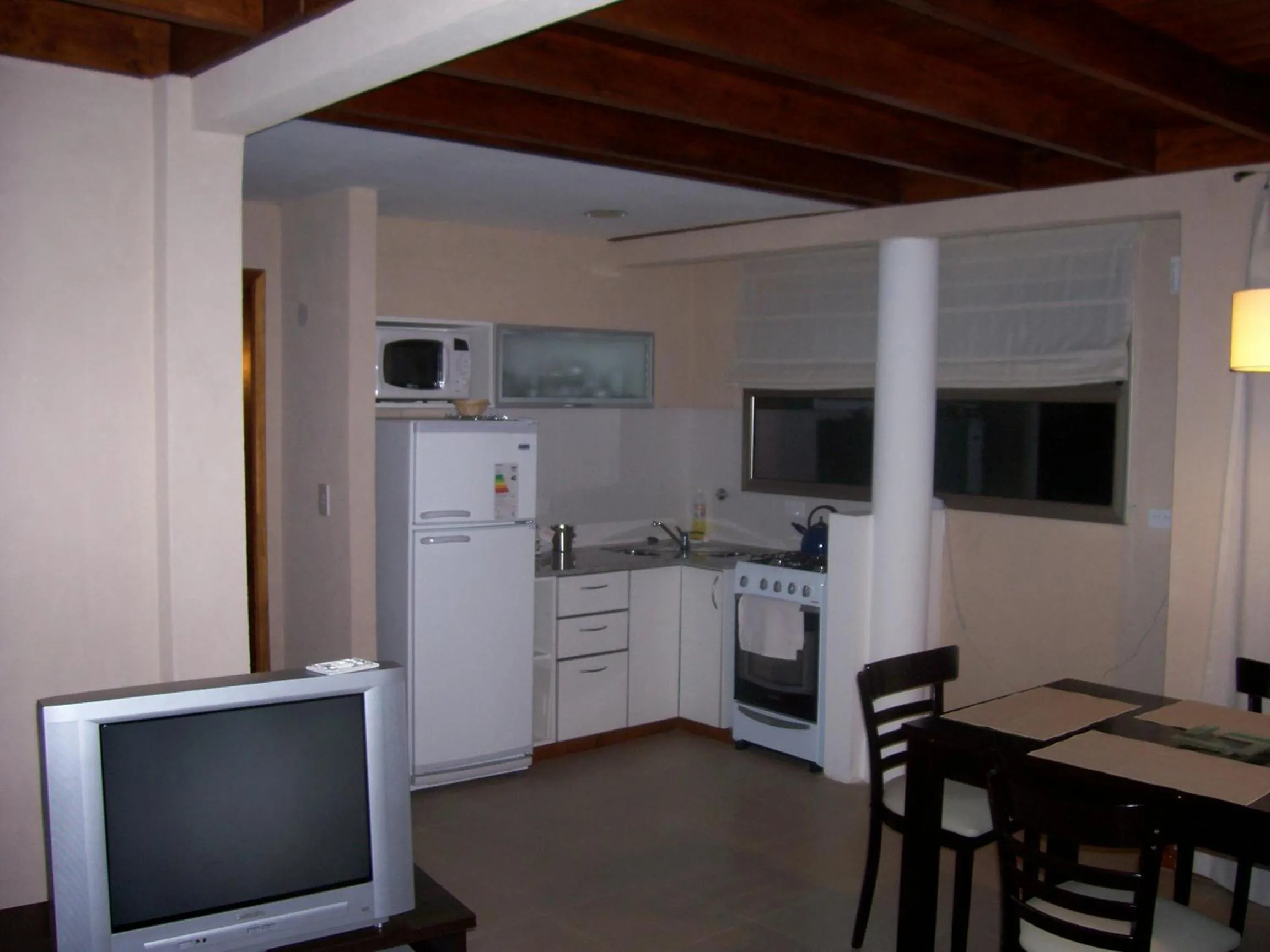 Kitchen or kitchenette in Viñas del Mar Apart & SPA Aparthotel