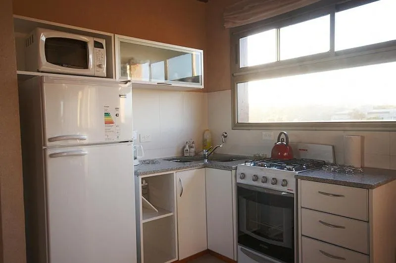 Kitchen or kitchenette in Viñas del Mar Apart & SPA Aparthotel