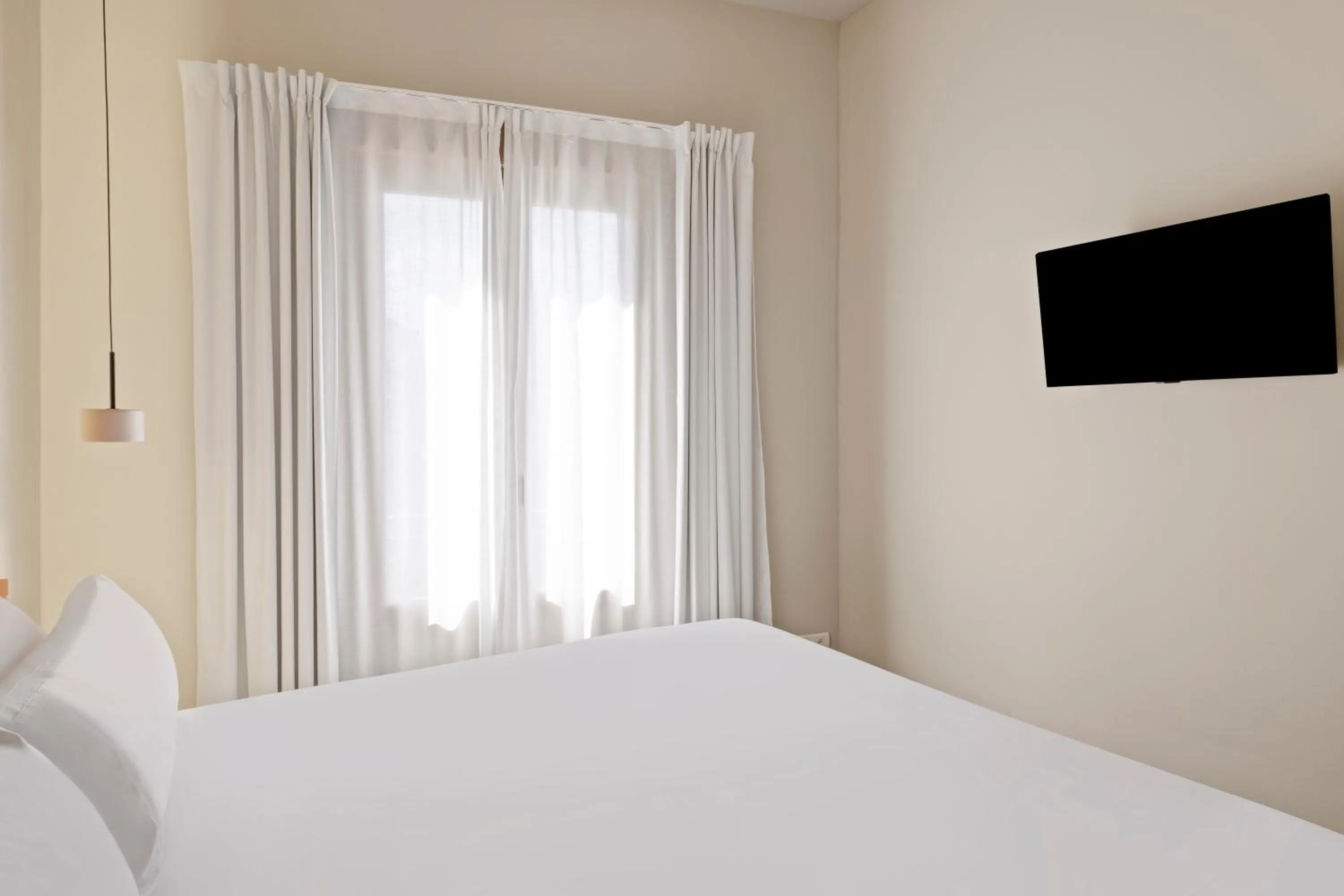 Bed in B&B HOTEL Apartamentos Madrid Centro Fuencarral 46