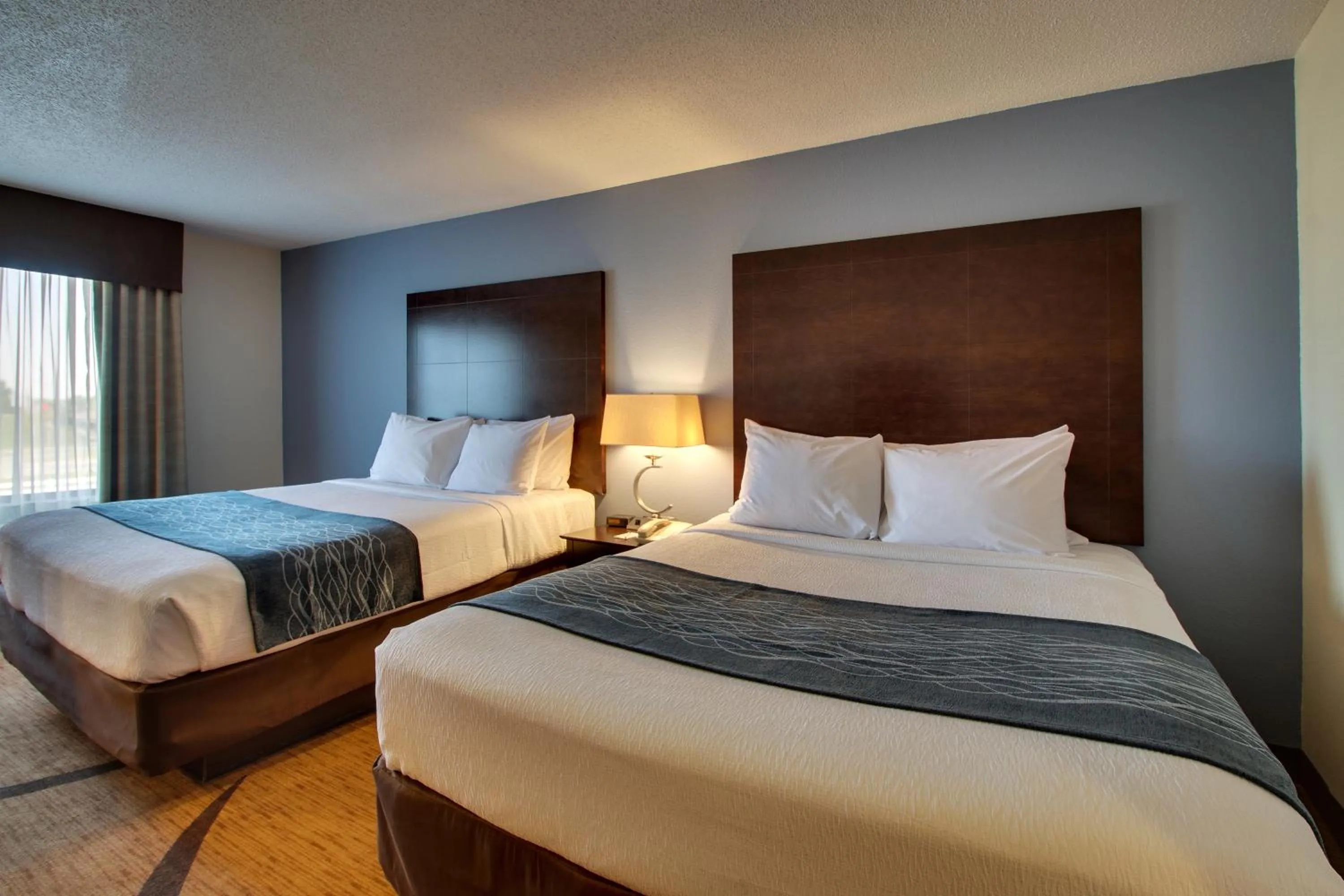 Bed in Greenfield Inn & Suites Owensboro, KY Airport